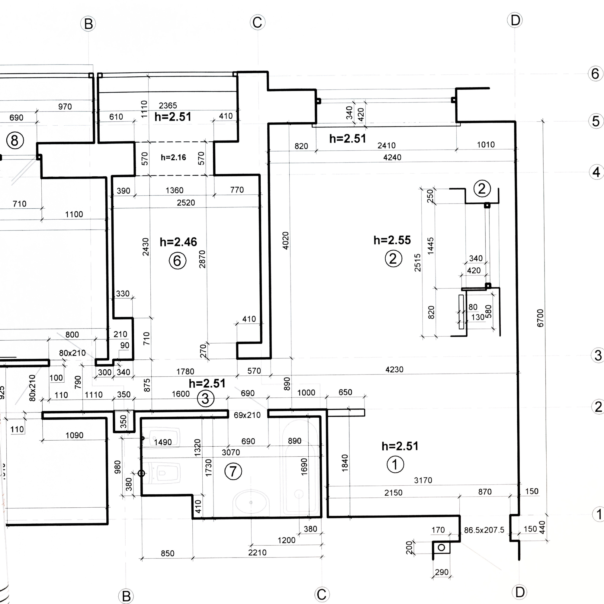 Detailed 2d architectural blueprint of a building floor plan with measurements, room labels, and ceiling heights indicated.