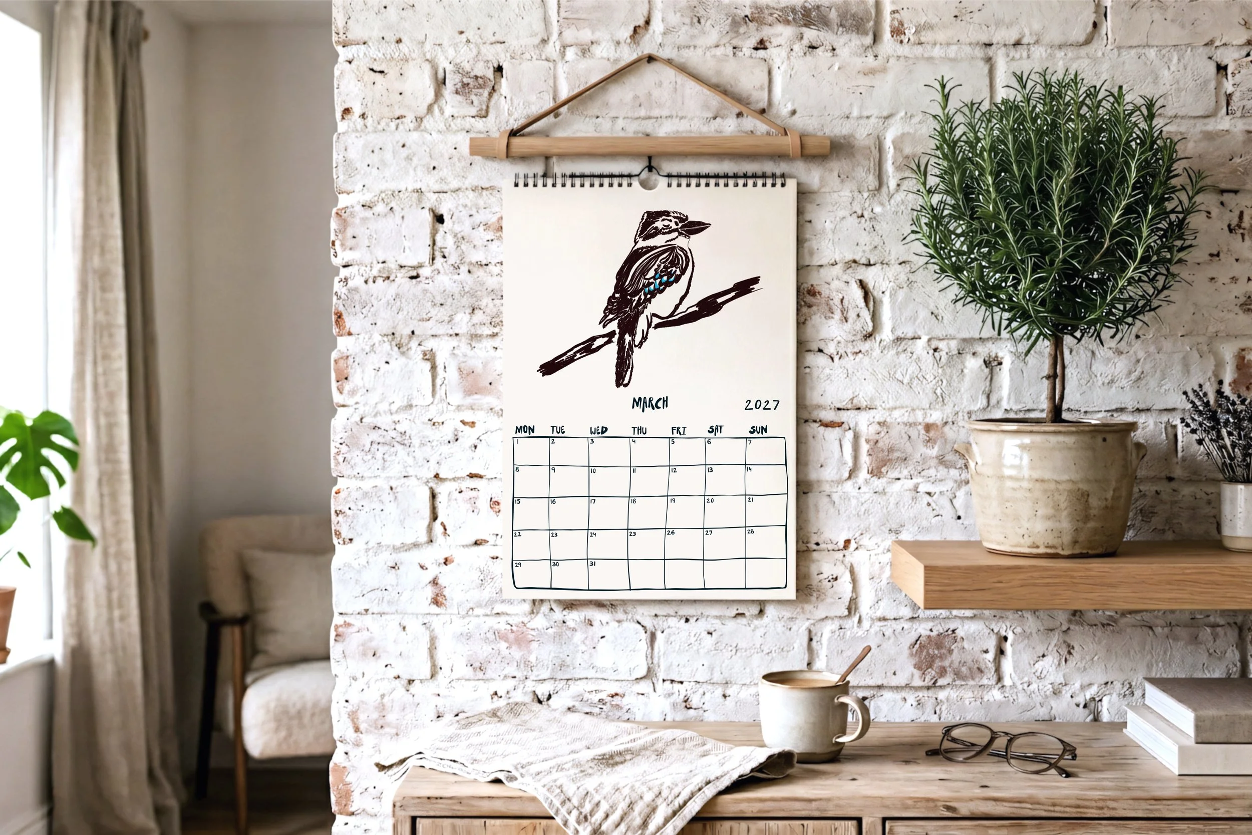 March calendar page featuring a hand-drawn ink illustration of an Australian kookaburra on a branch