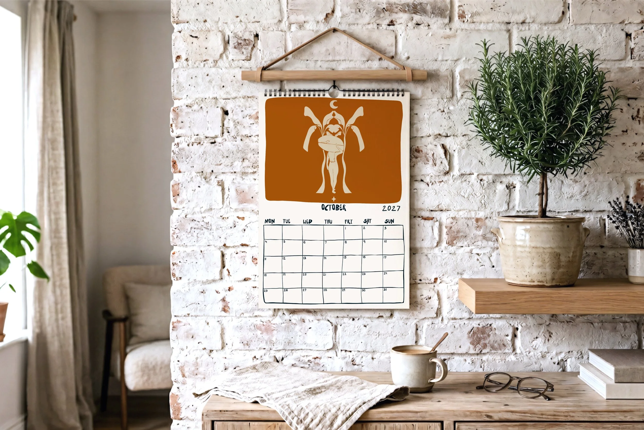 October calendar page with a terracotta and cream illustration of a surfer holding a board among plants and a crescent moon
