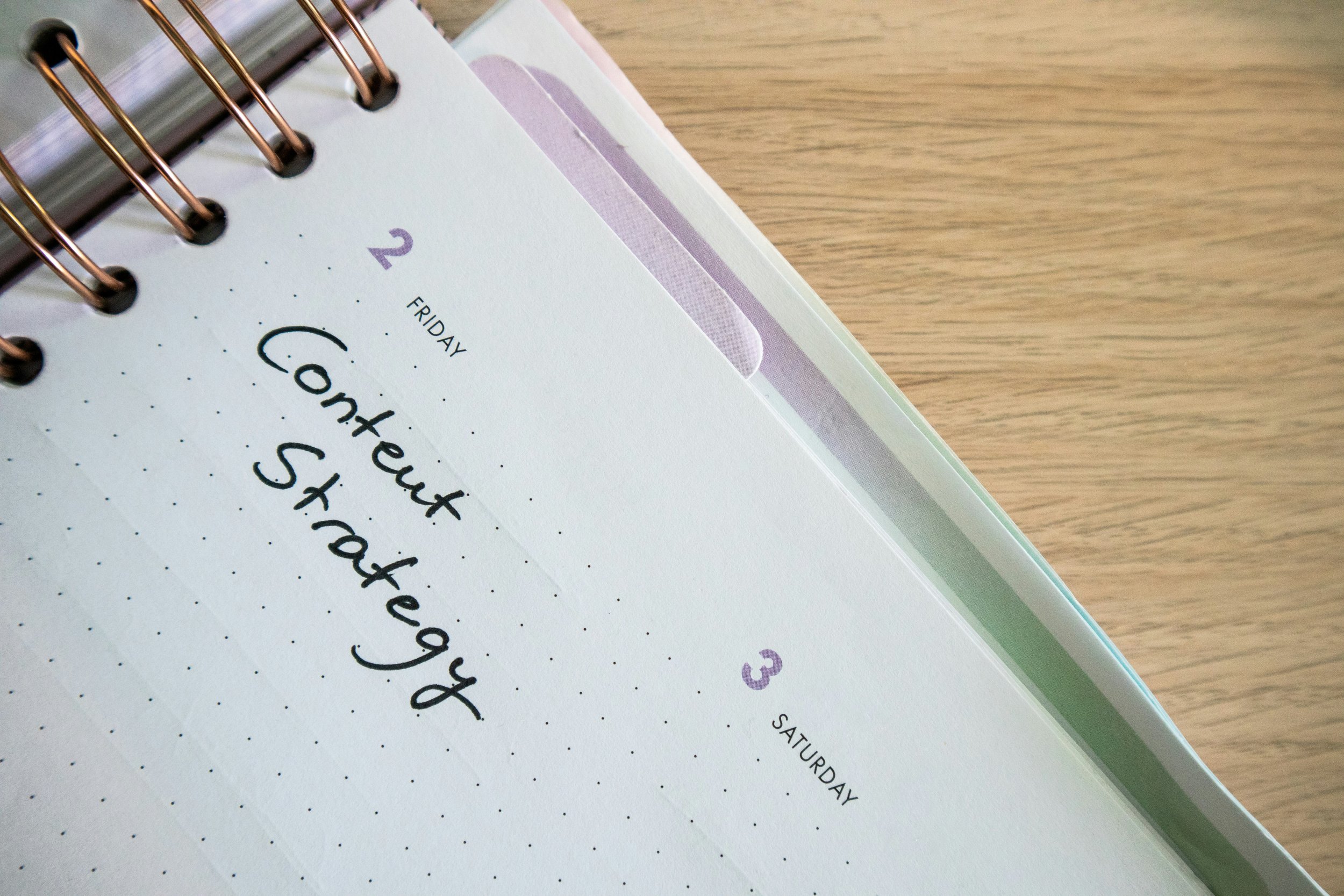 calendar showing the words 'content strategy' for creating instagram captions