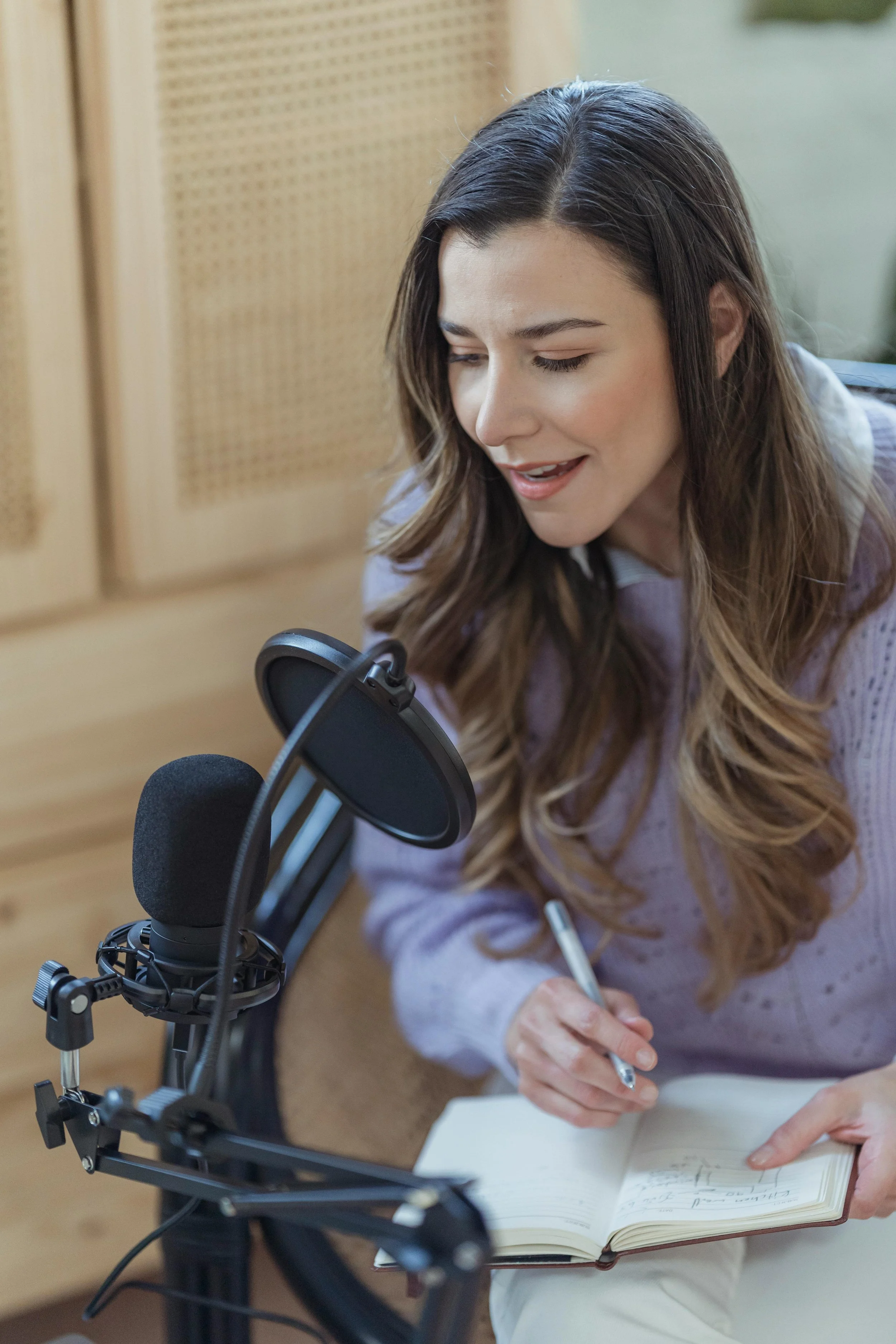 female entrepreneur recording a podcast