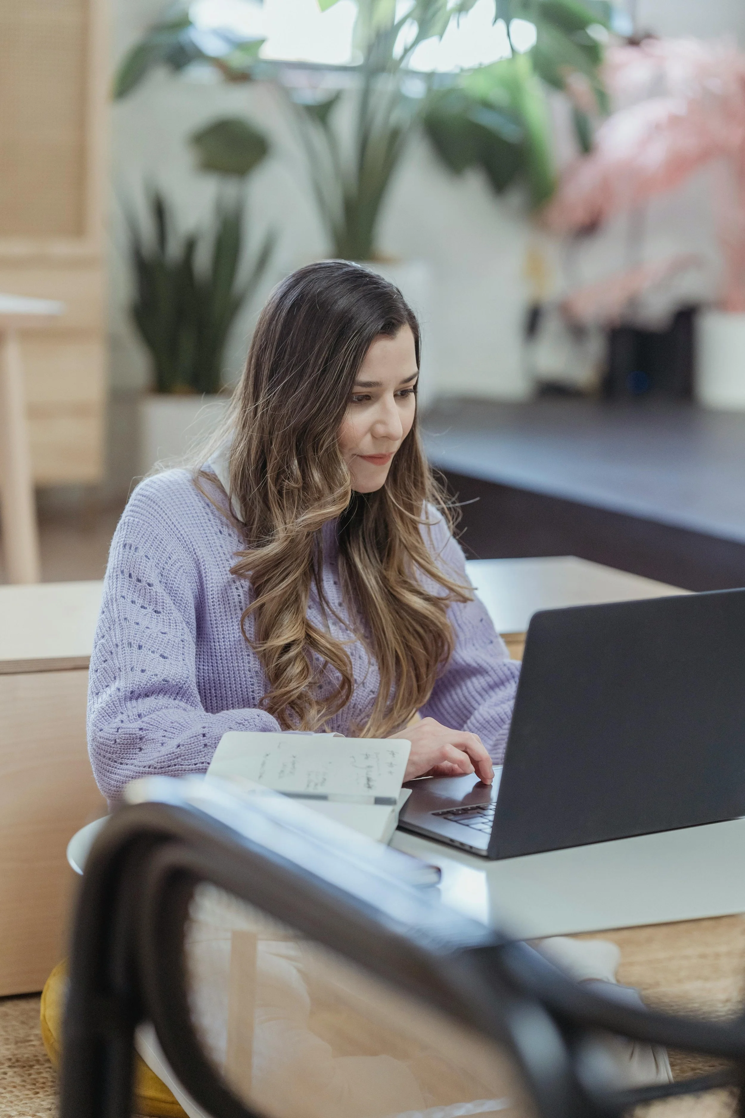 female entrepreneur using riverside.fm
