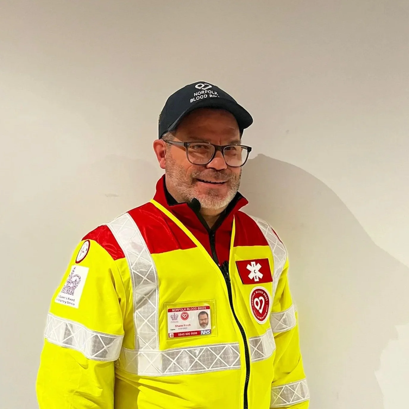 A pink background with a white heart shape and the word "vacancy" repeated in a circle around it.