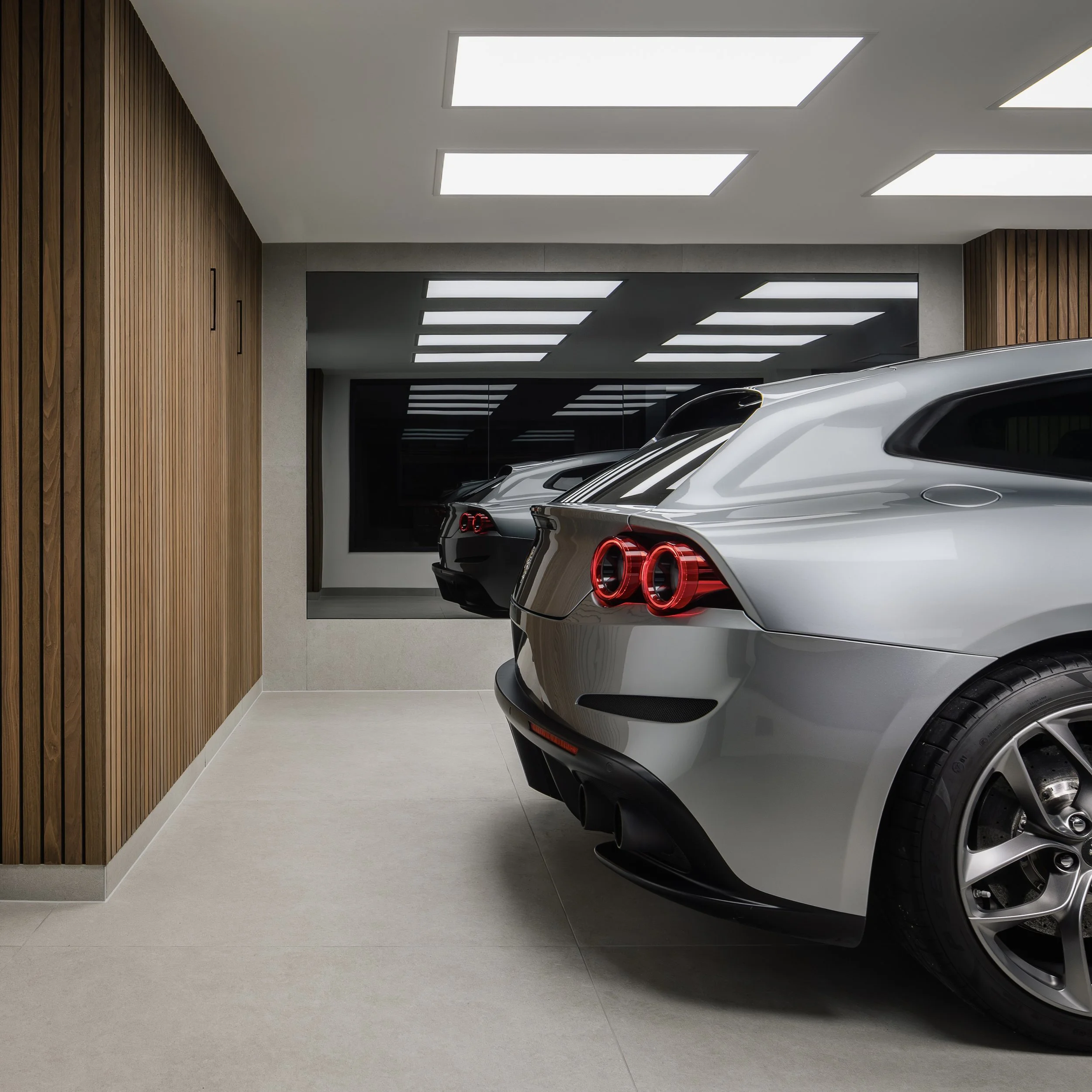 A modern, state-of-the-art paint protection film instillation studio. Featuring a silver Ferrari GTC 4 Lusso. This car has been wrapped in STEK DYNO gloss PPF, using bespoke paint protection film patterns which have been accurately cut to size using 