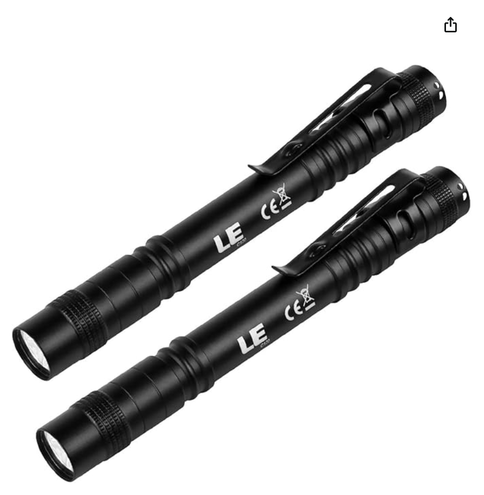 Two black tactical flashlights with clip attachments, labeled LE, with ridged handles and adjustable focus. They appear to be compact and suitable for portable use.
