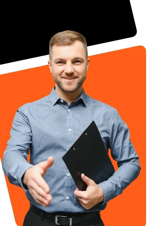 A man in a blue button-up shirt smiling and shaking hands, holding a black clipboard, standing in front of an orange and black geometric background.