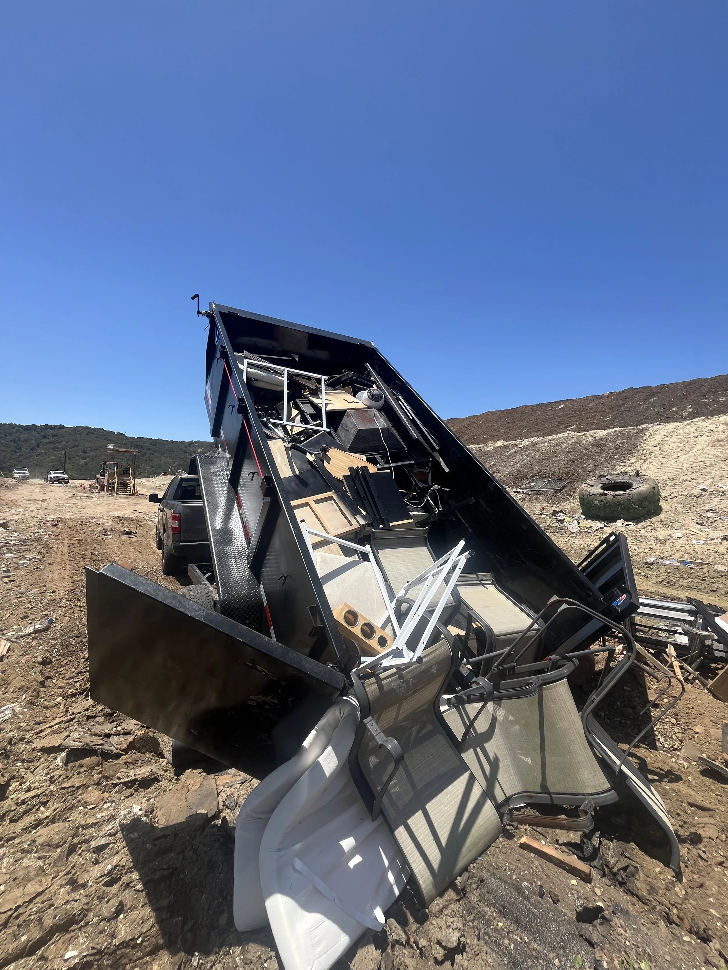 A full load of junk being unloaded at the dump near San Luis Obispo