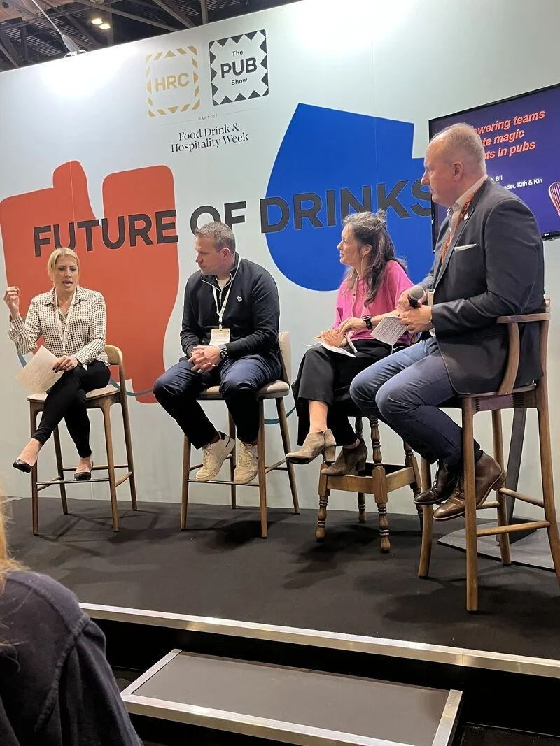 Cassie Davison speaking on a panel at The Pub Show, seated alongside other hospitality speakers during a discussion on the Future of Drinks stage.