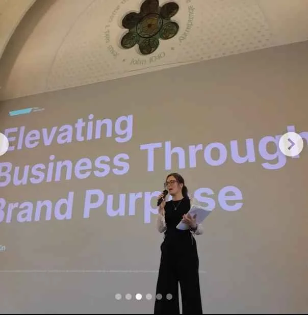 Cassie Davison giving a presentation about independent hospitality, operator reality and belonging as a competitive advantage.