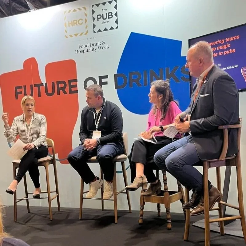 Cassie Davison on stage at a hospitality trade event