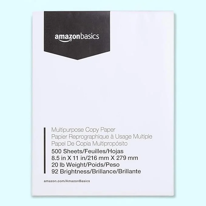 A white pack of AmazonBasics multipurpose copy paper with black and white label, indicating 500 sheets, 8.5 x 11 inches, 20 pounds, and 92 brightness.