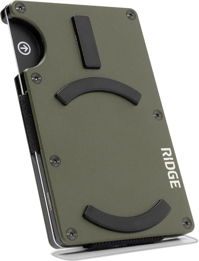 A portable Rigde device with a smartphone connected to it, featuring black rubber grips, a green casing, and control buttons on the top.