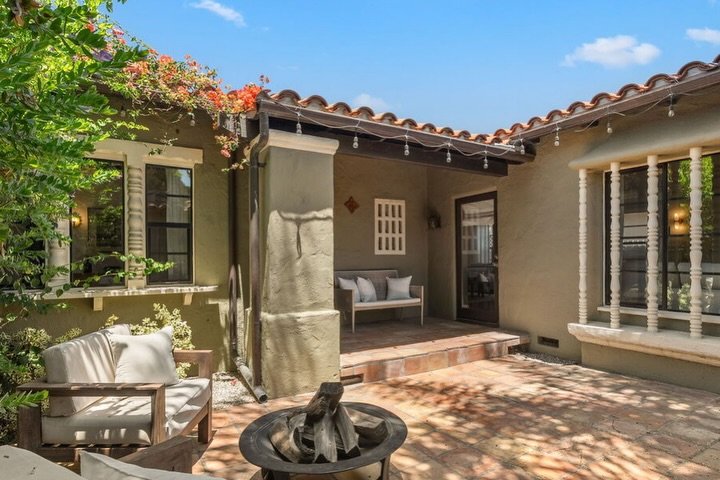 A charming Spanish style home in Reynier Village, filled with timeless character 🙂&zwj;↕️ Inside, you&rsquo;ll find soaring beamed ceilings, arched openings, an original fireplace, and a dramatic picture window that fills the living room with natura
