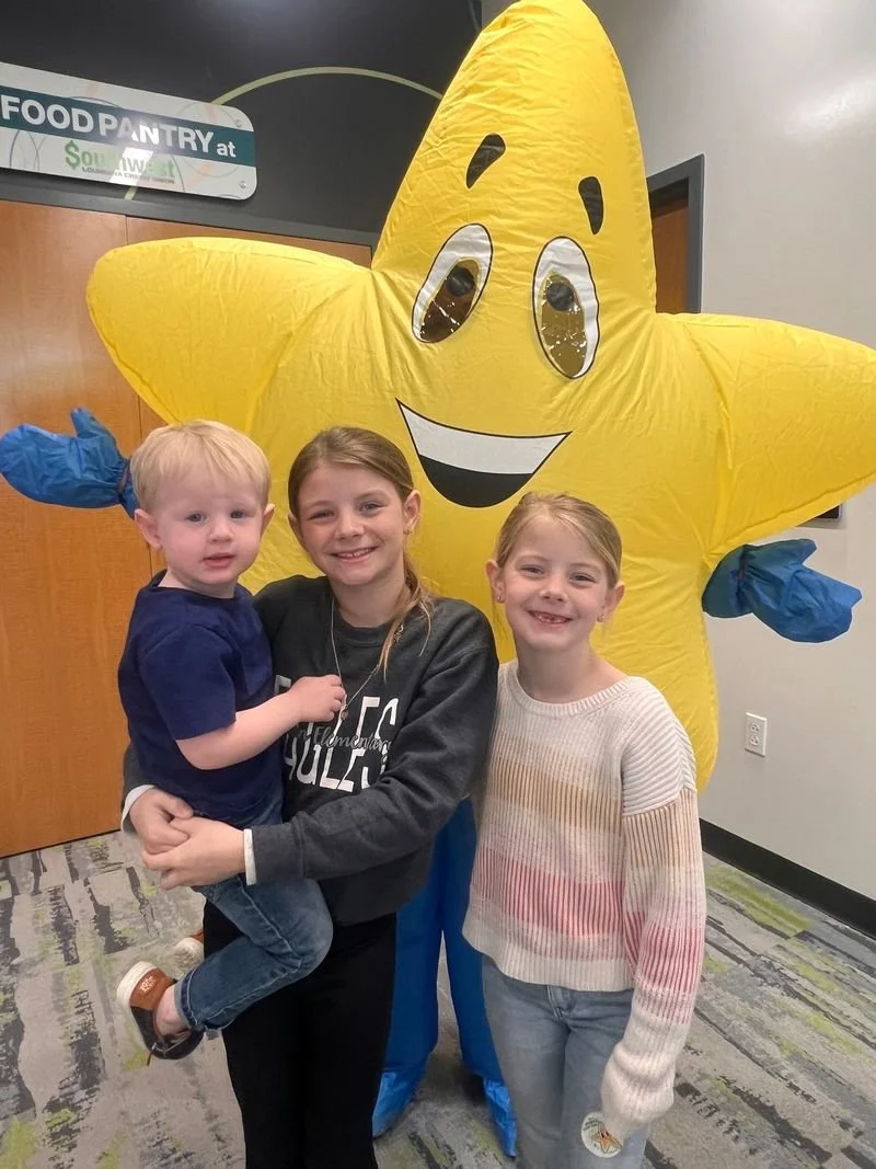 3 children at the SWLA CU food pantry