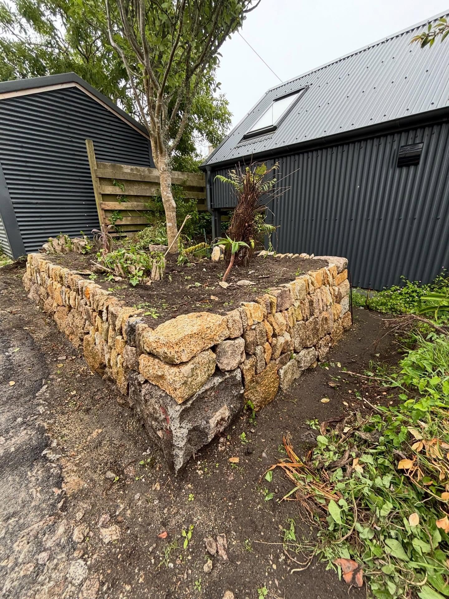 STONE PLANTING BEDS 

Shady woodland planting to follow in this drystone retaining bed. Tree ferns and poplar trees giving us the framework for this driveway planting.

With integrated seat section finished and ready for summer!

Alot of stone posts 