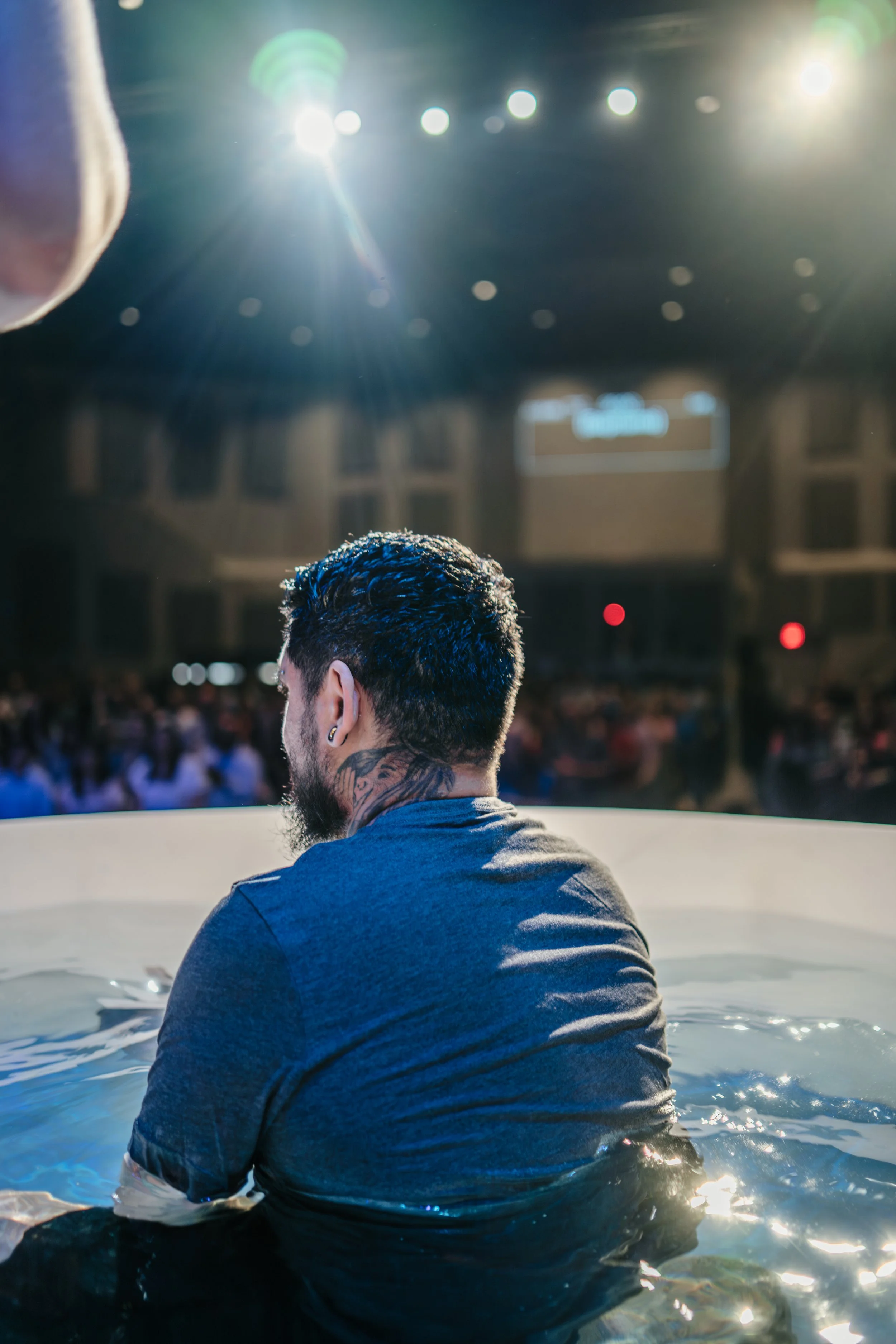 Man preparing to get baptized and declare his faith at Mission City Church on Easter Sunday