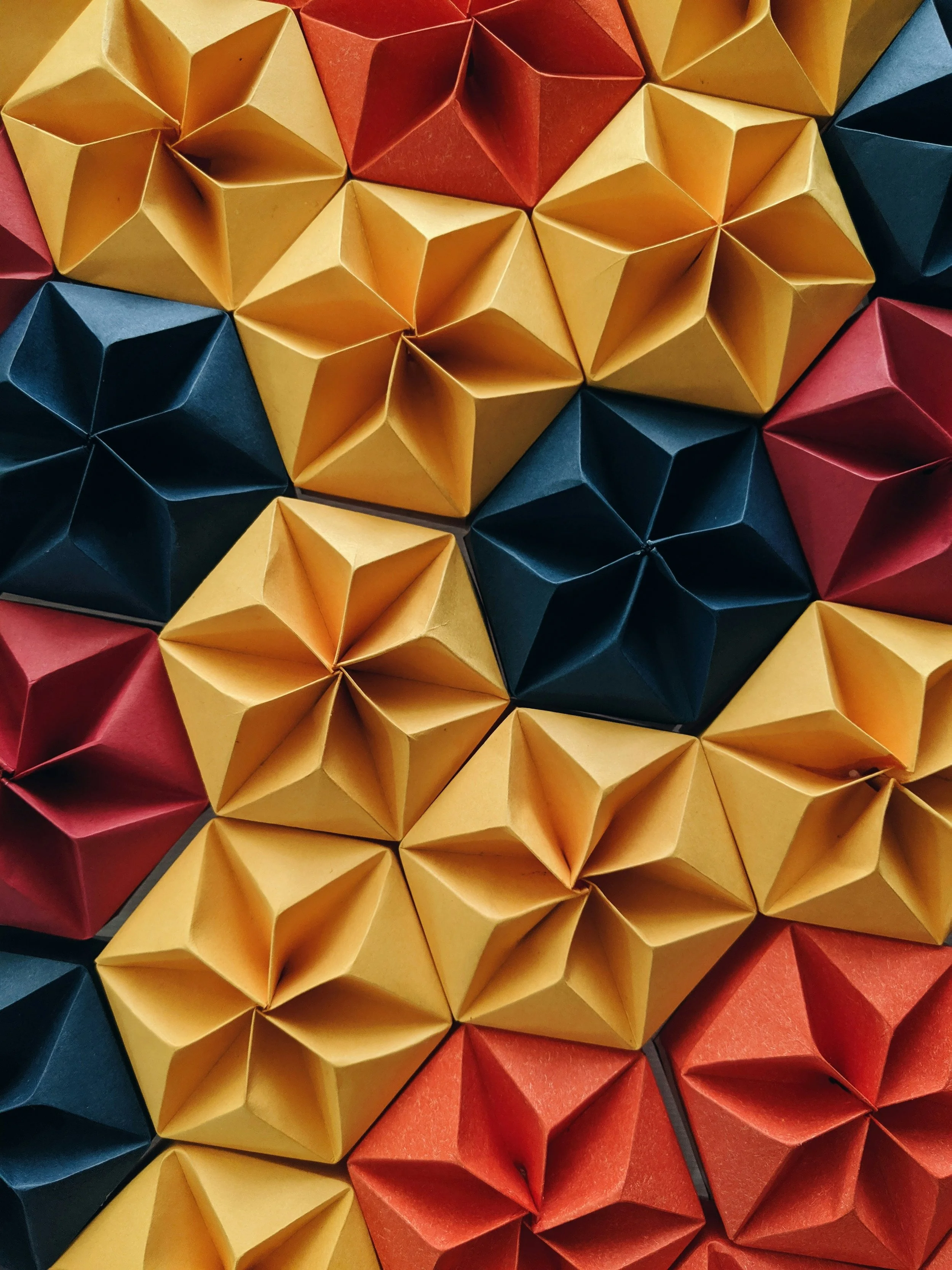 Geometric origami pattern – representing team strength, connection, and resilience