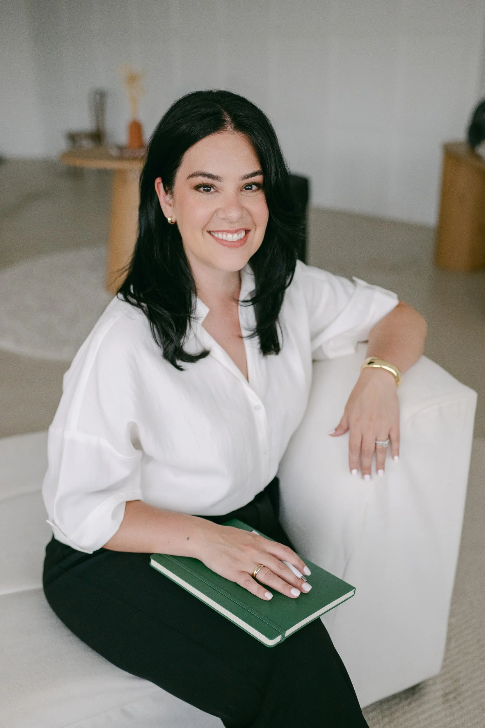 Caitlyn Beattie, founder of Origami HR, smiling in office setting