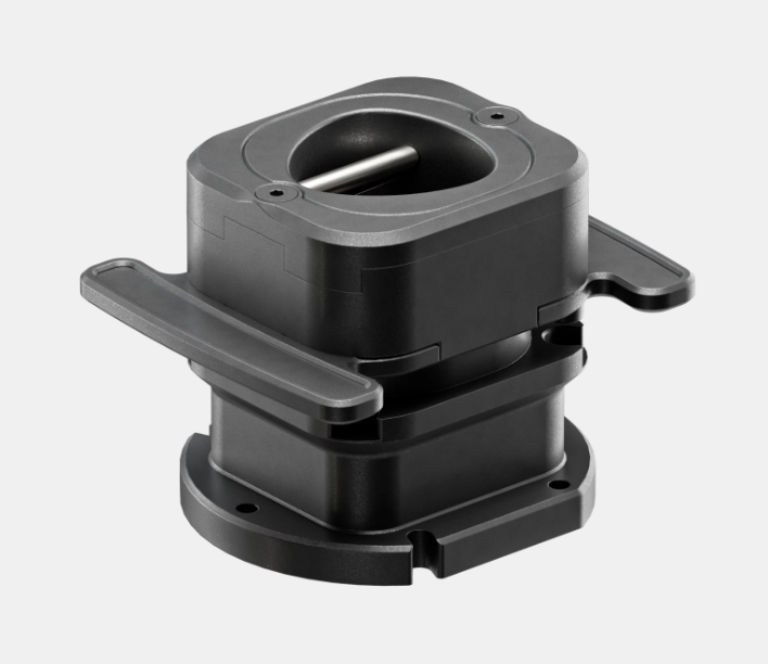 Two black, round, mechanical components with mounting holes and internal parts, likely used in robotics or machinery.