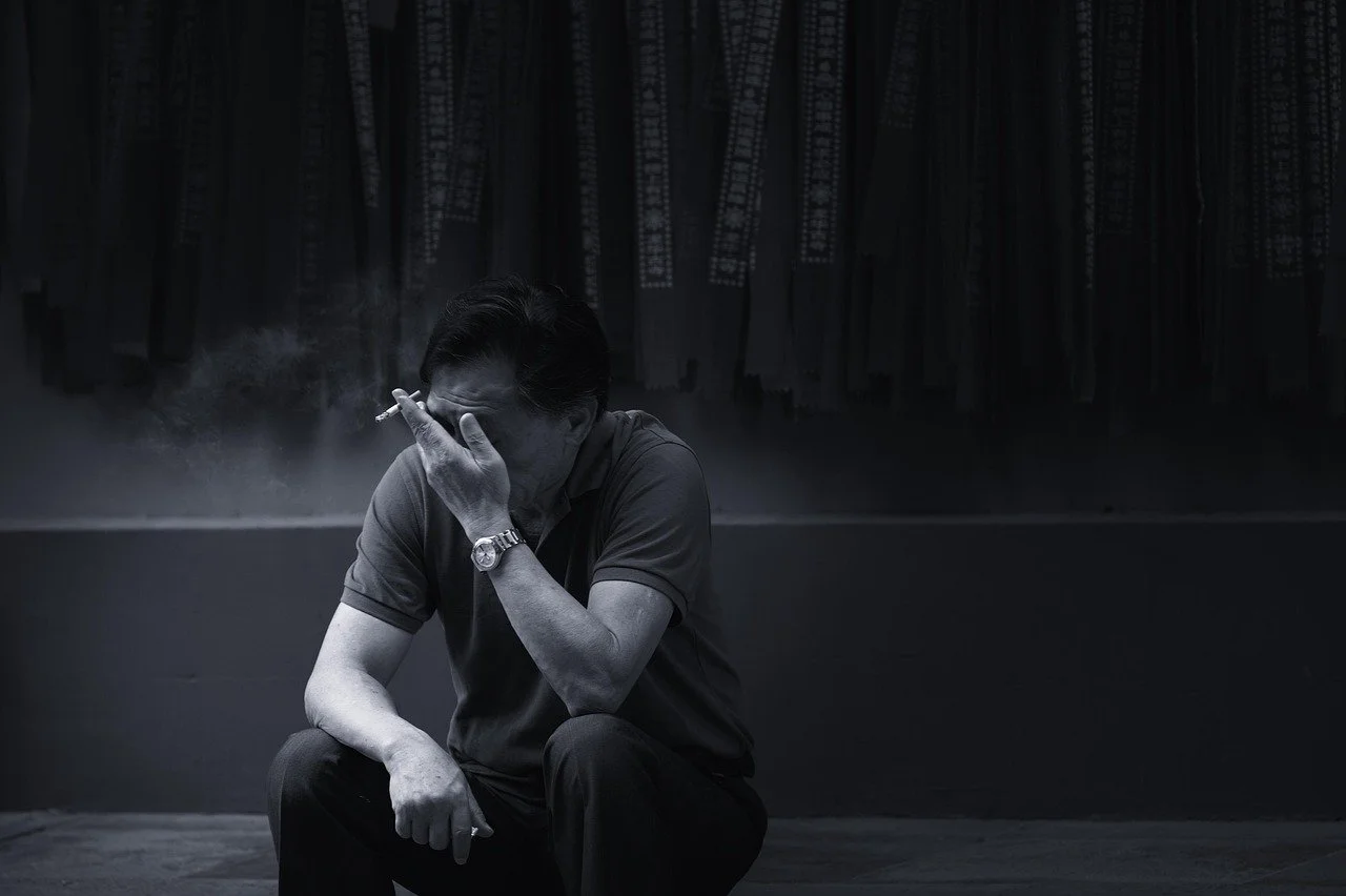 sad man smoking