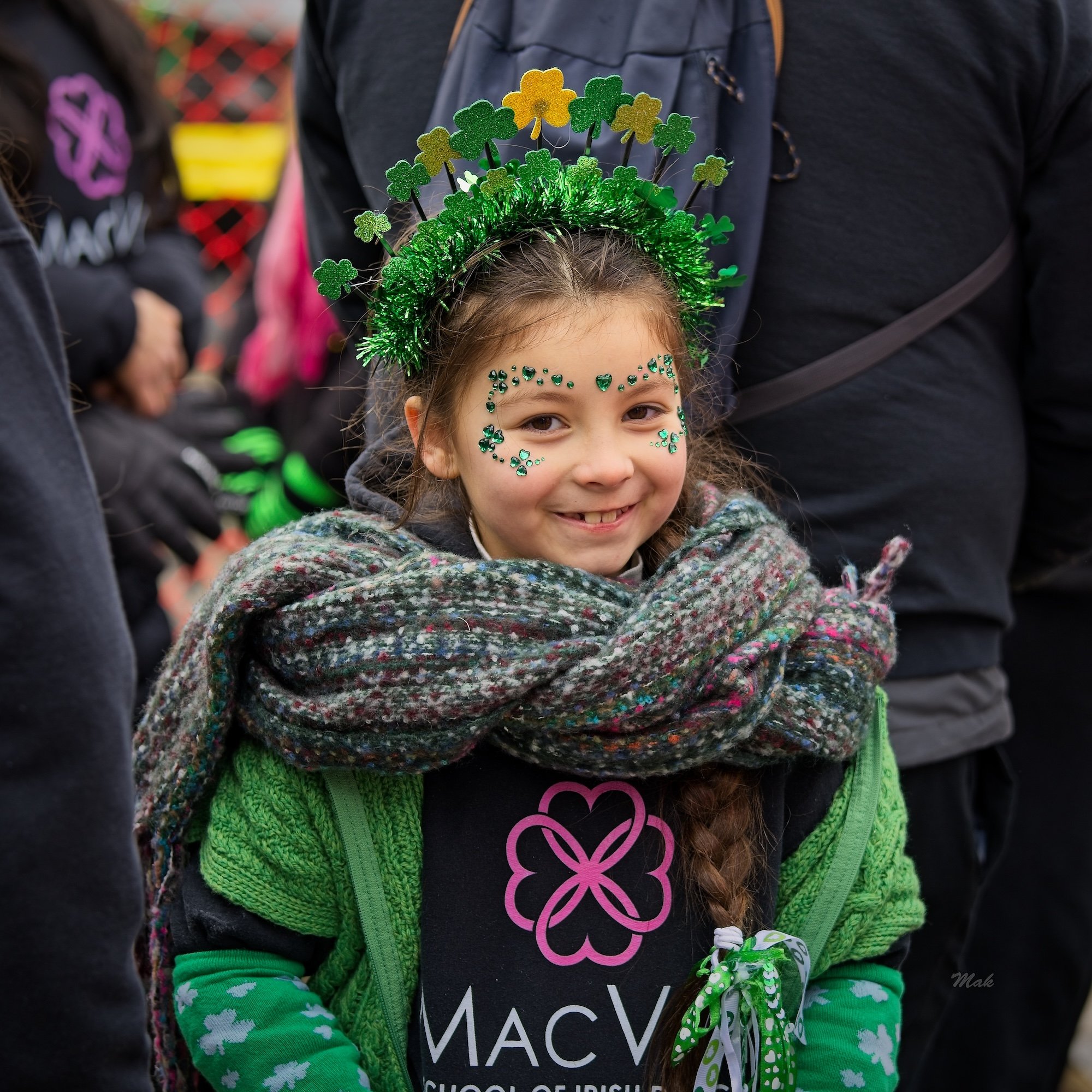 Child in green outfit at the Toronto St. Patrick’s Day Parade