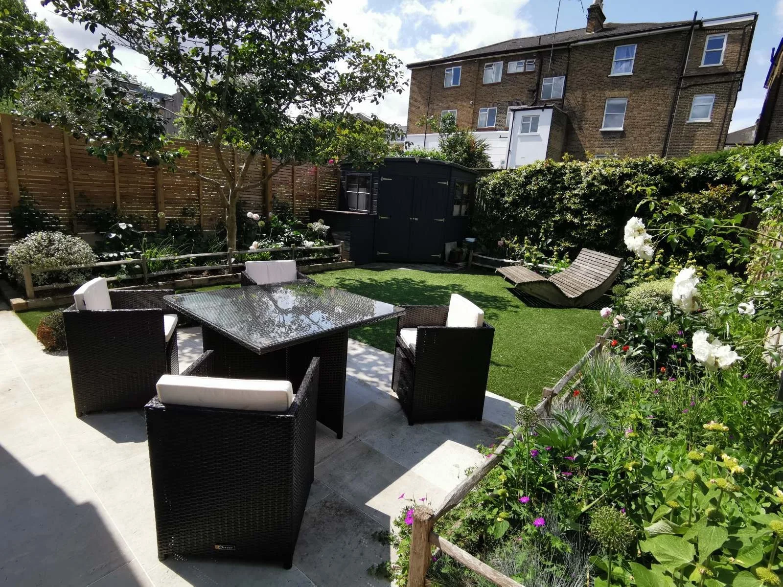 City garden, garden seating, patio, herbaceous borders, Camellia, garden design