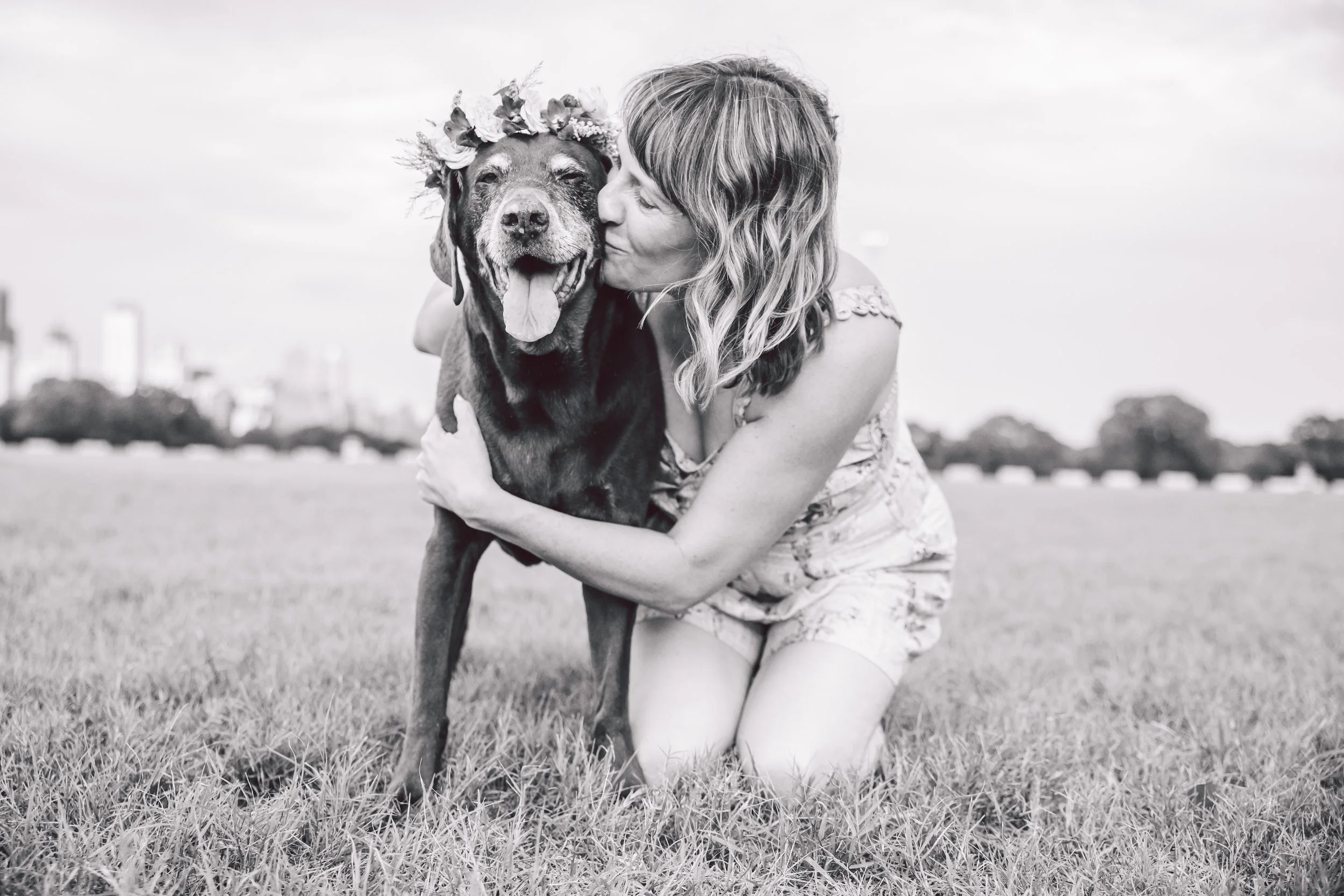 Jen Ostrich with her dog Koko wearing his senior flower crown.