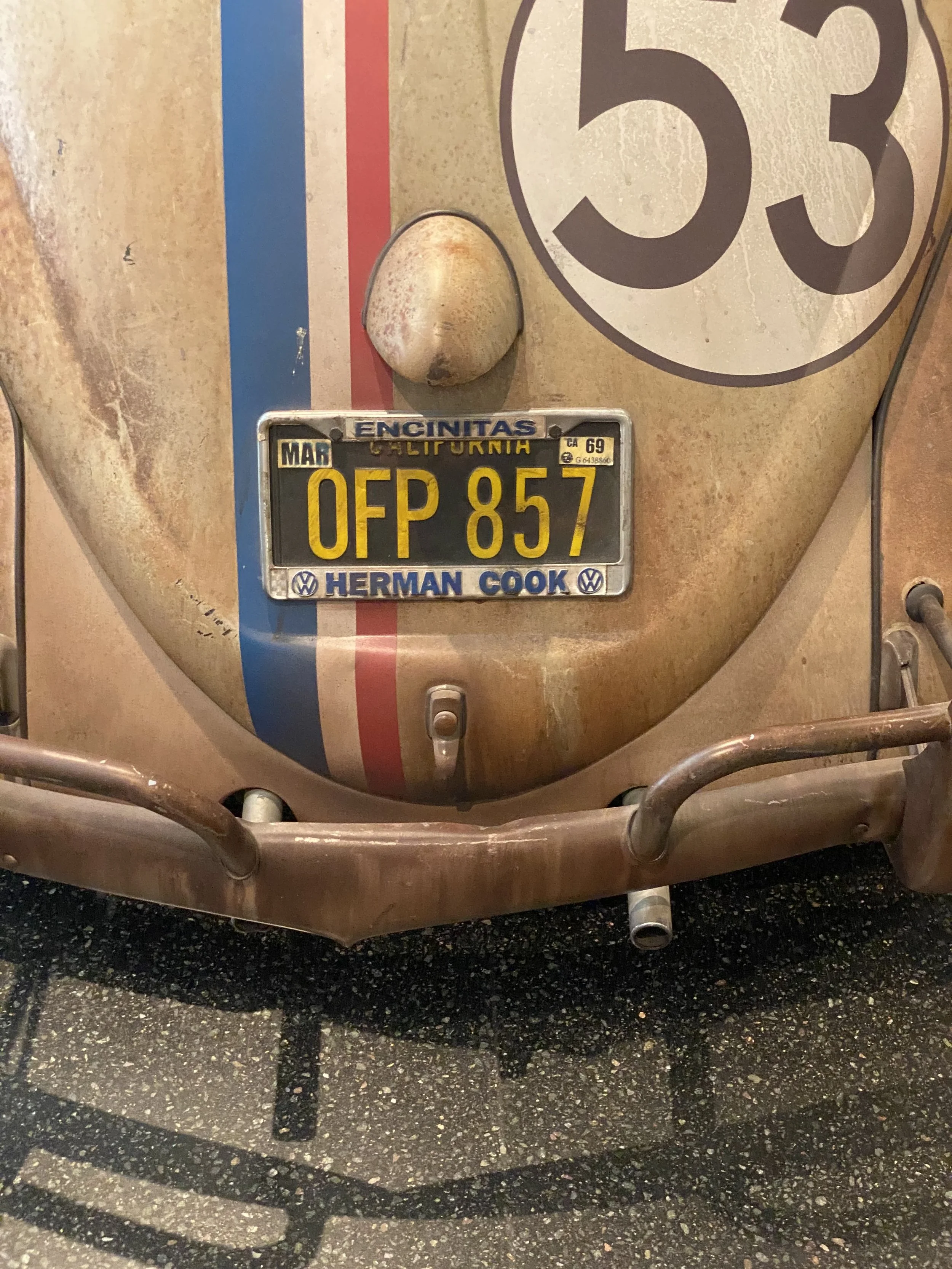 "Herbie the Love Bug" Volkswagen beetle found at Auto museum in Hamburg, Germany; interestingly, car's license plate is from same dealership that works on my family's Volkswagen.
