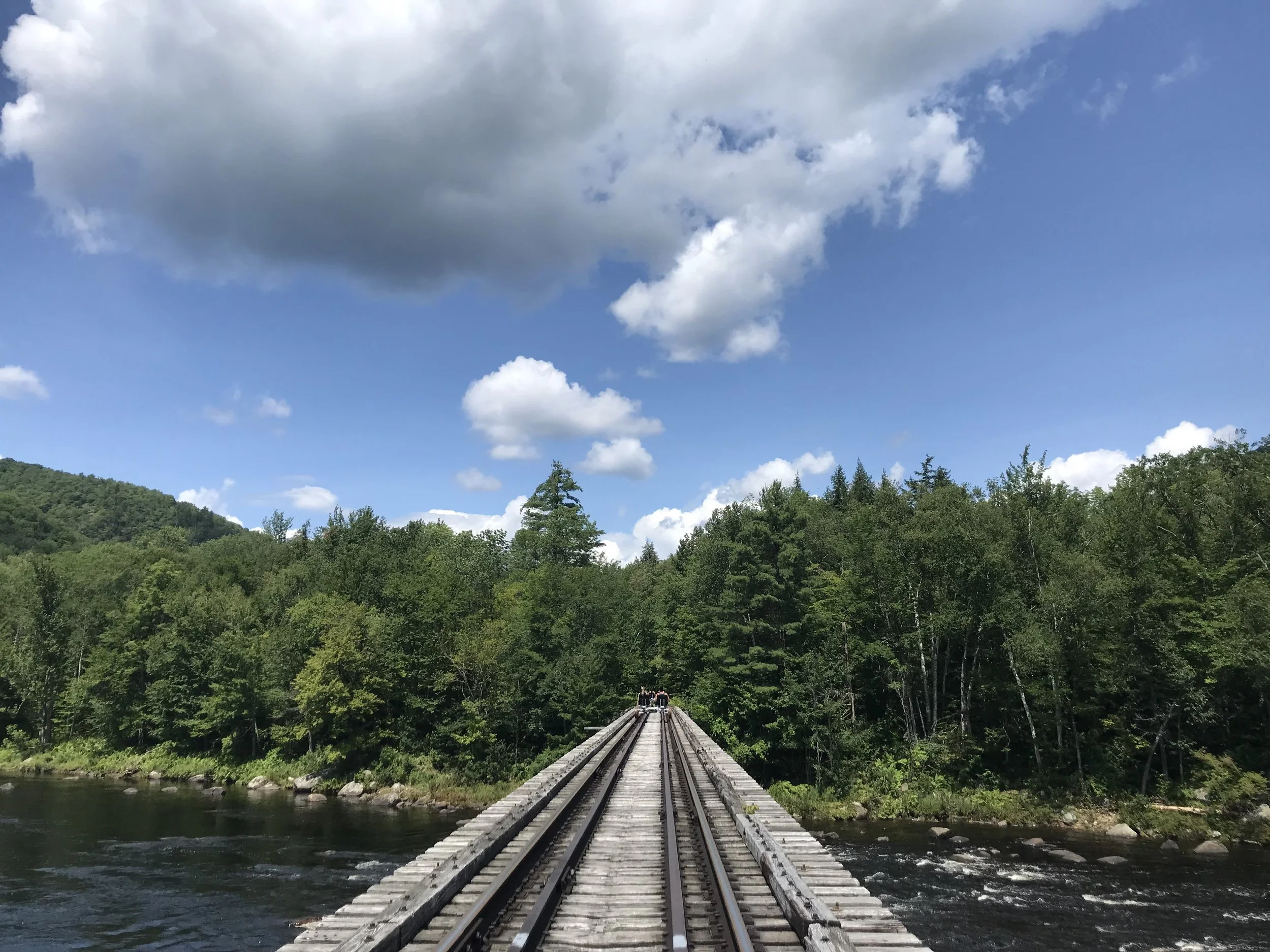 Railcart tracks across Hudson river in the Adirondack Mountains of New York.