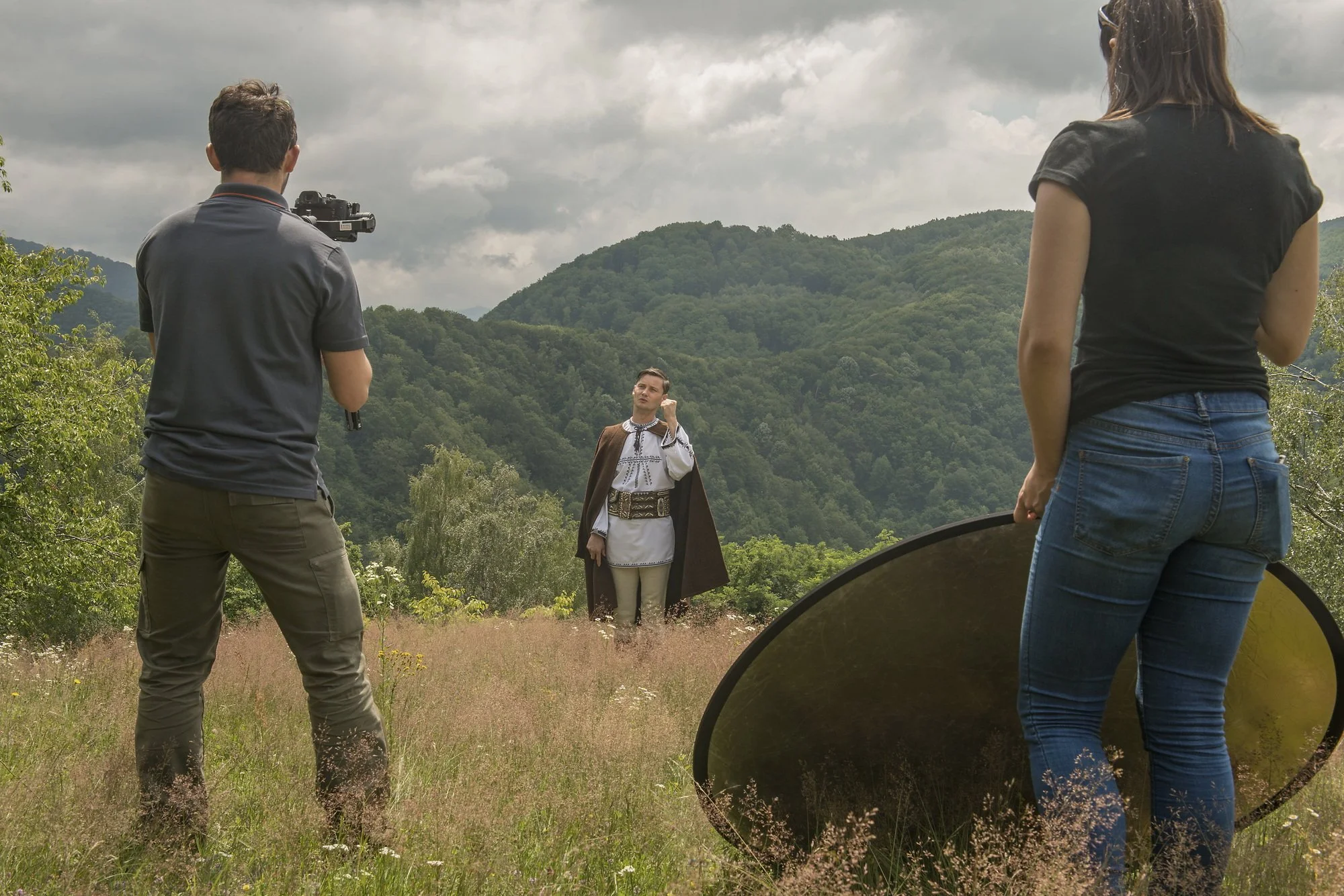 A folk singer is performing for a videoclip of his music, in the ruins of Costesti Dacian Fortress