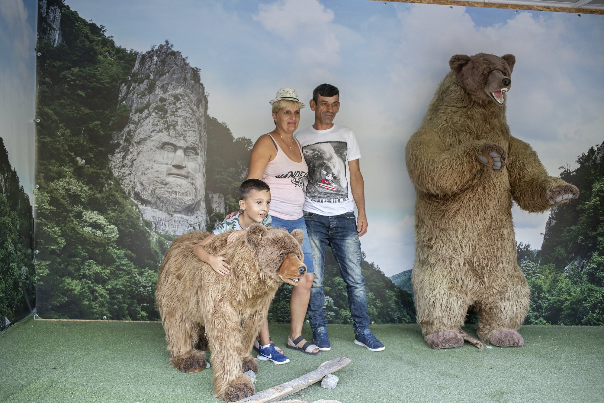 People are taking a souvenir picture at Eselnita, where the huge statue of Decebal was carved recently. 