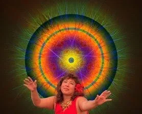 Veenaa Saynana Dolphin Heart Alchemy raising her arms in front of a colorful, radiant mandala-like pattern.