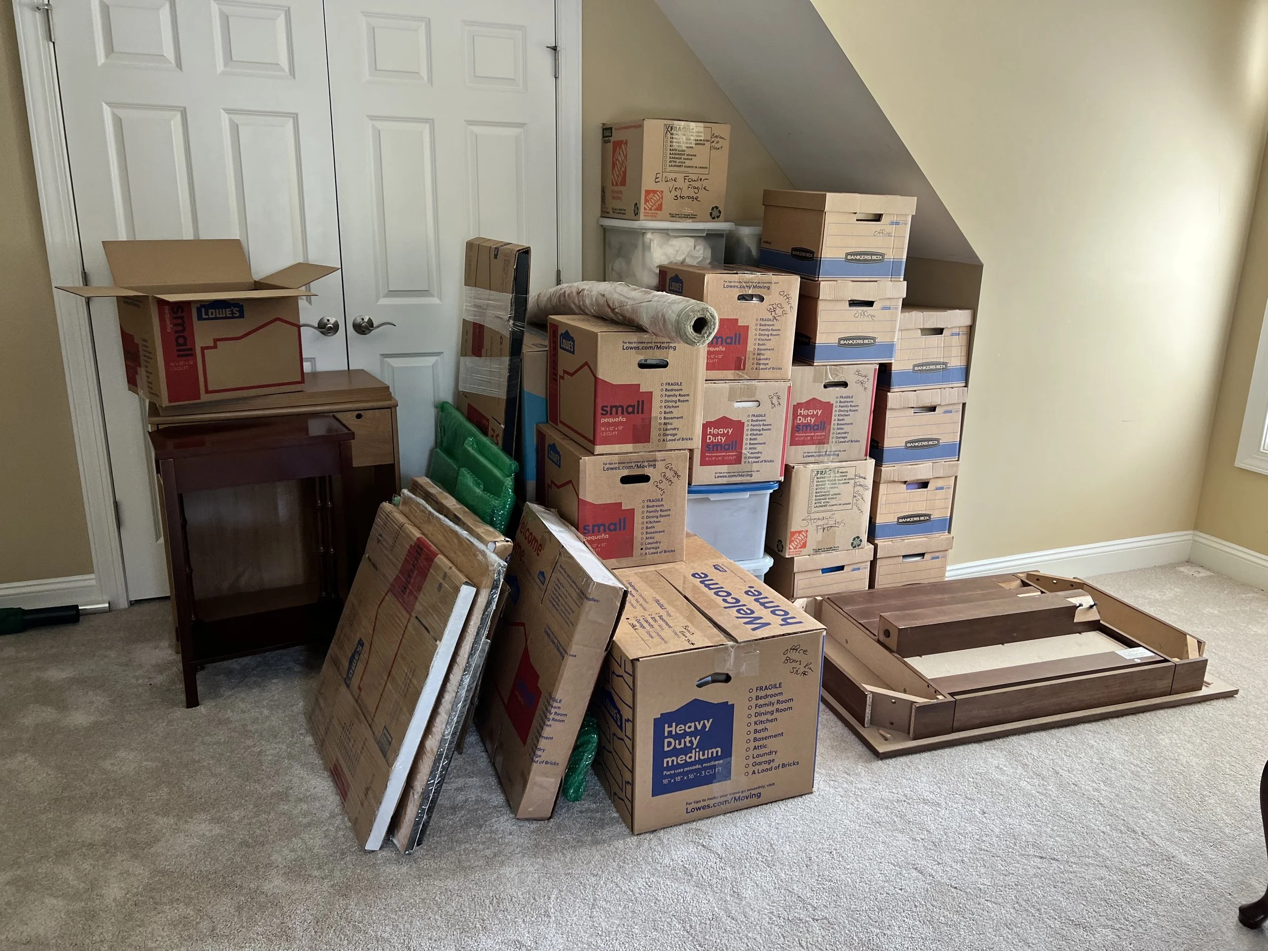 boxes packed and ready for movers to load them into moving truck