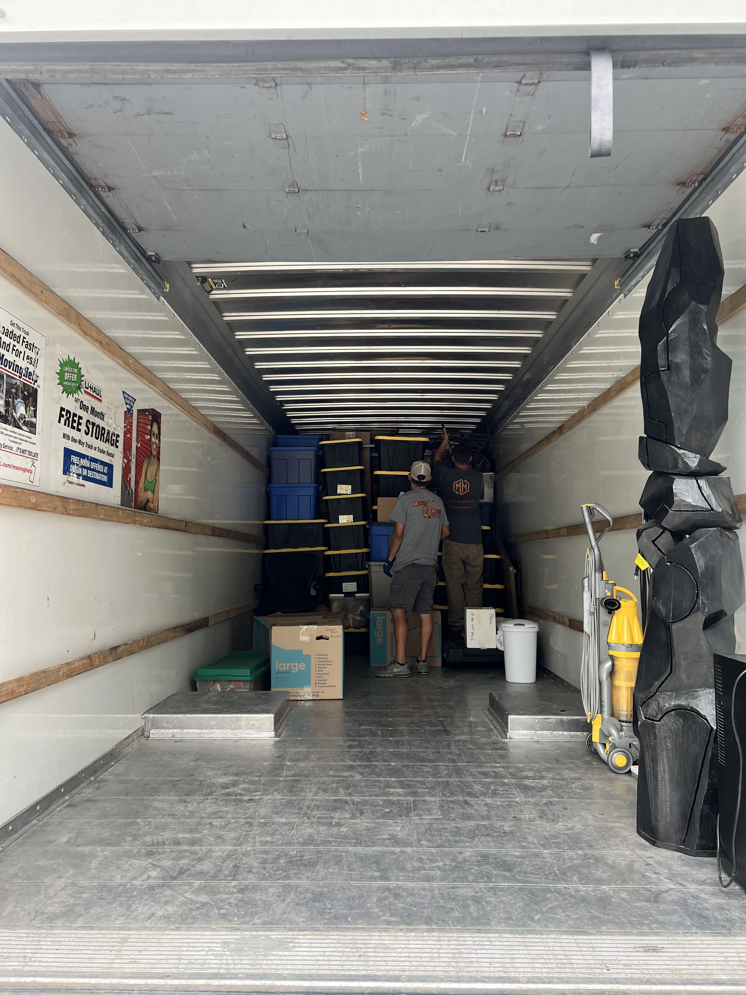movers loading a truck with boxes