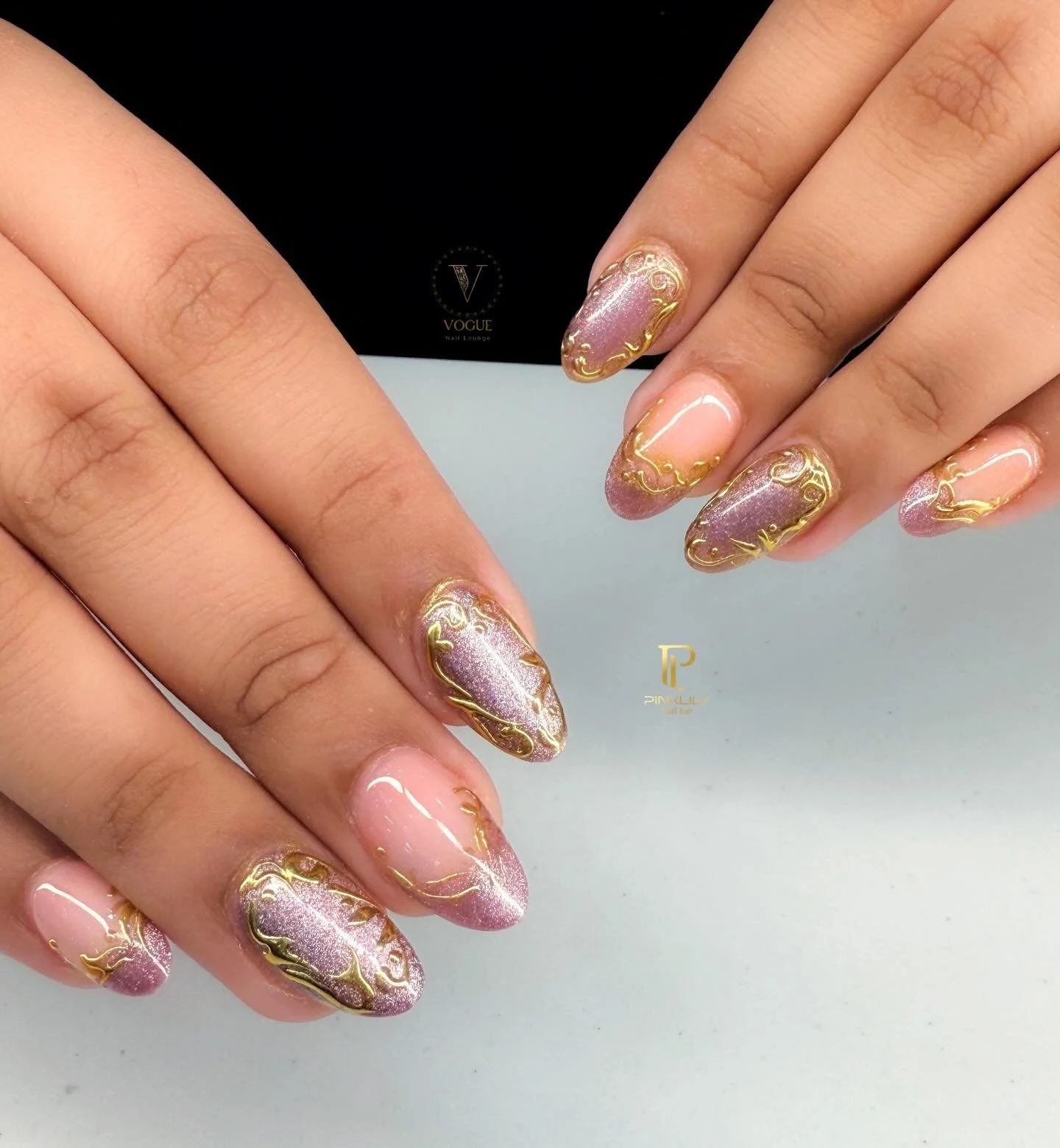 Cat eye and gold chrome accents ✨ 

Get ready for the holidays with us here at PinkLily Nail Bar &amp; Vogue Nail Lounge! From holiday parties, to gift cards, and nails - we have it all just for you! 🎄

Walk-in or book an appointment now 💗

PinkLil