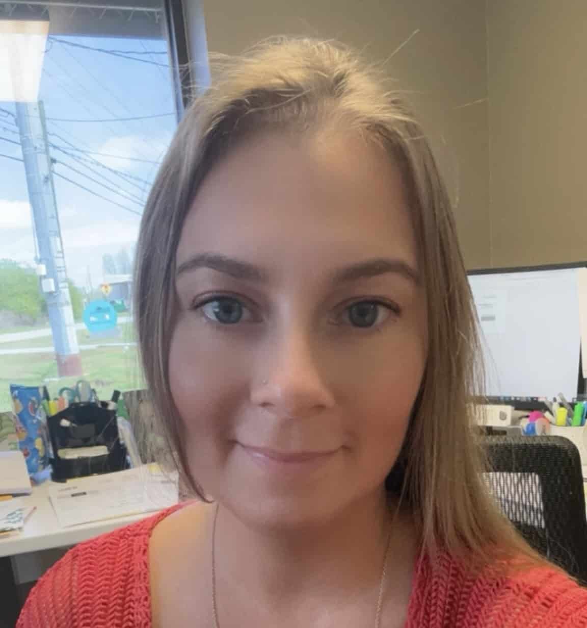 ublast employee candice dorsey smiling at camera in office