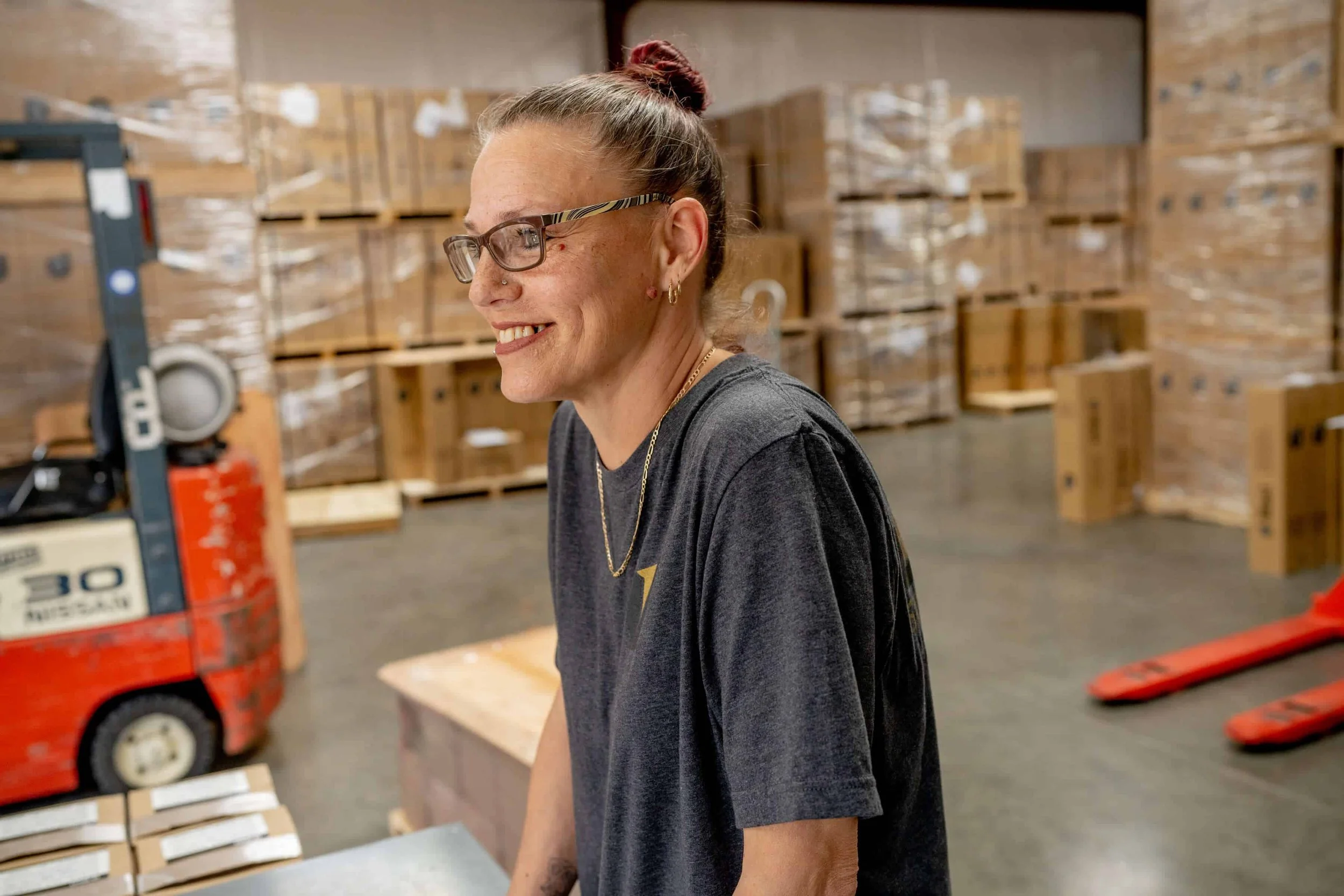 ublast employee jessie hysinger smiling in shipping warehouse