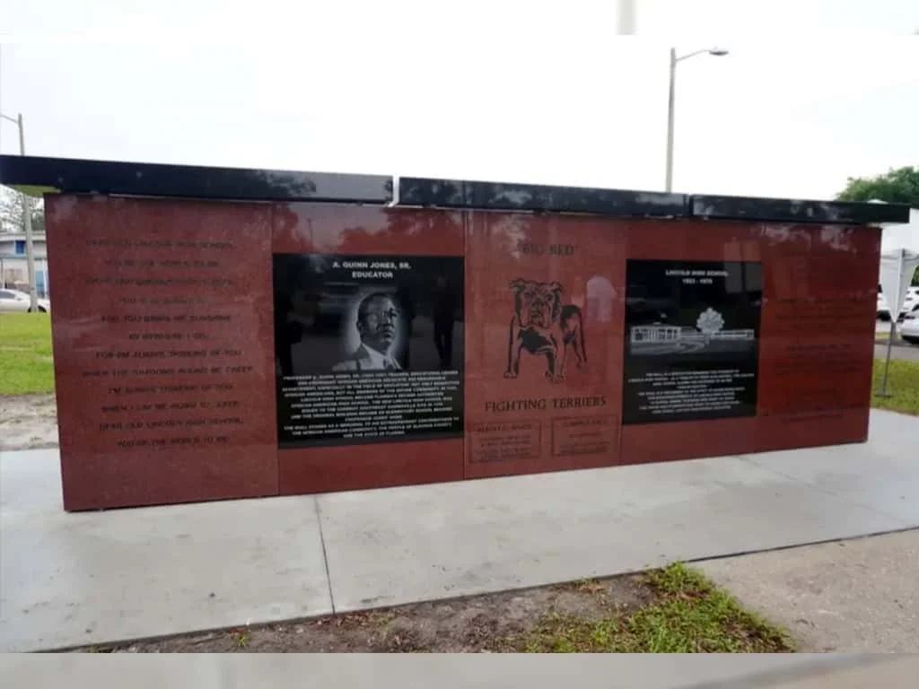 A large brown and black memorial designed and built by ot davis