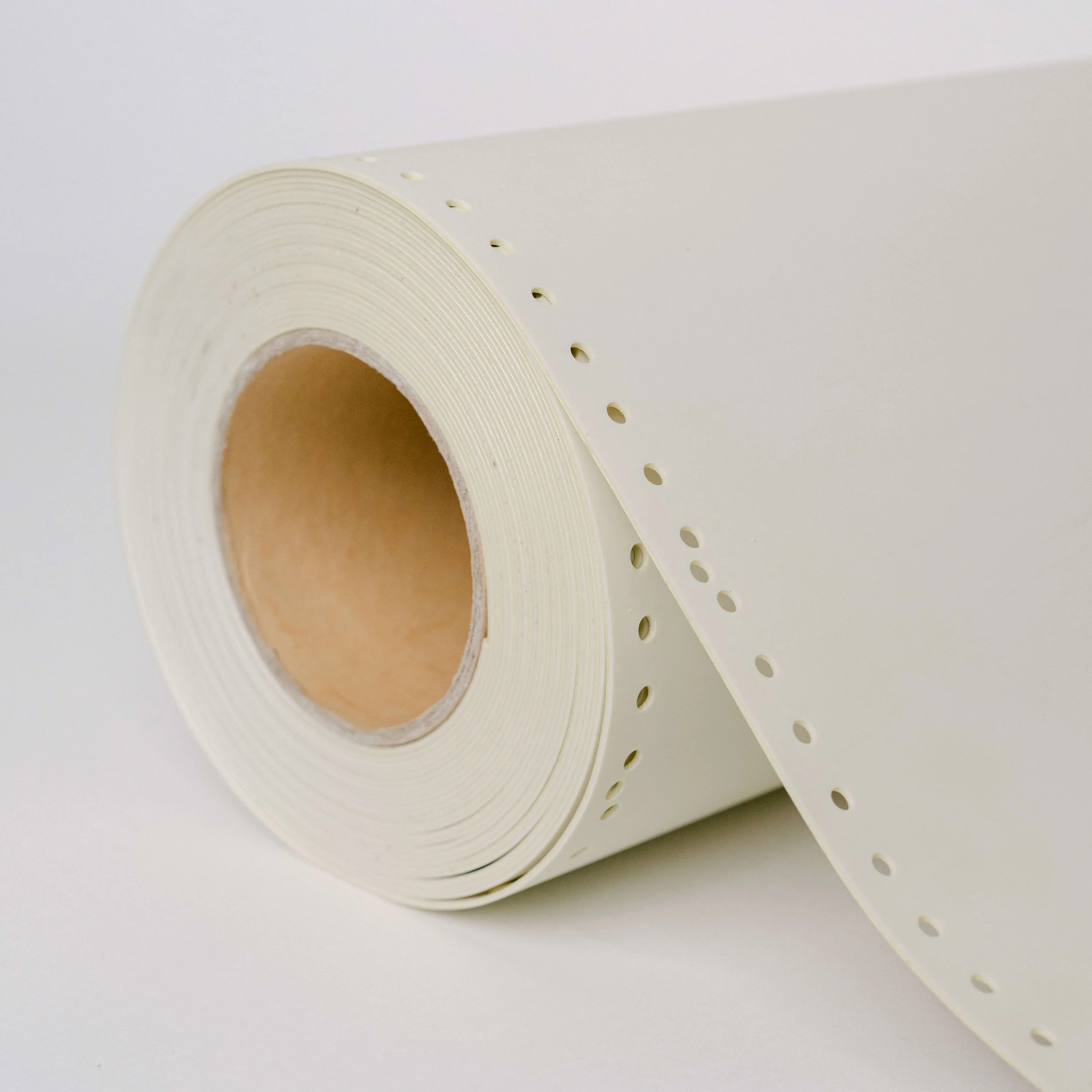 A roll of product UB2 laying on a table