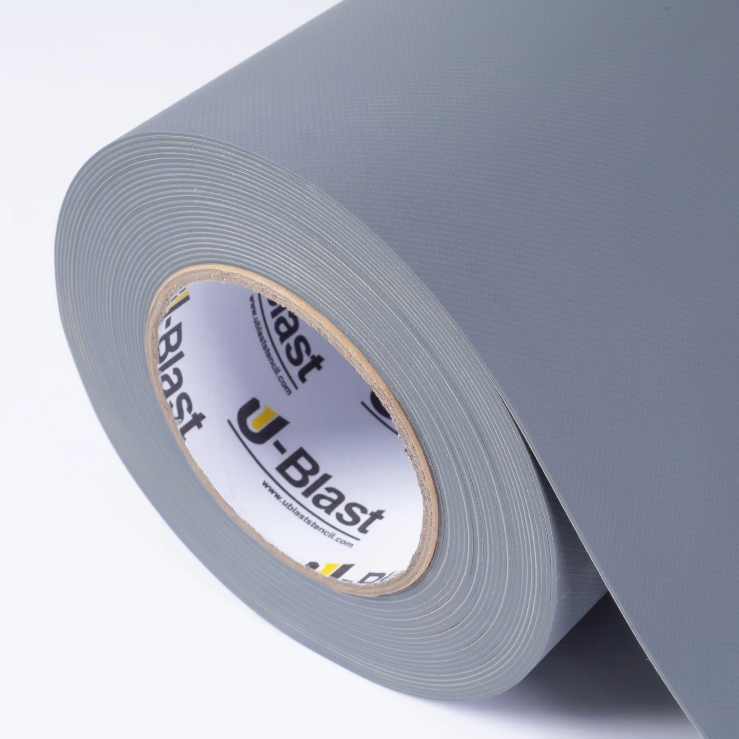 Roll of perforated black mounting tape with a U-Blast label inside the center hole.