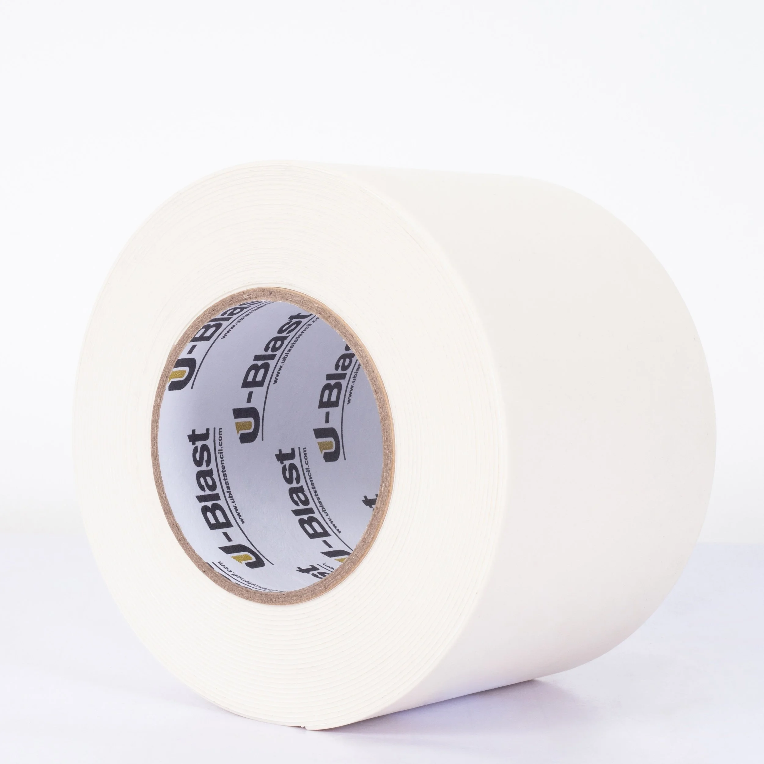 A roll of white adhesive tape with a brown cardboard core and a label inside showing the brand U-Blast.