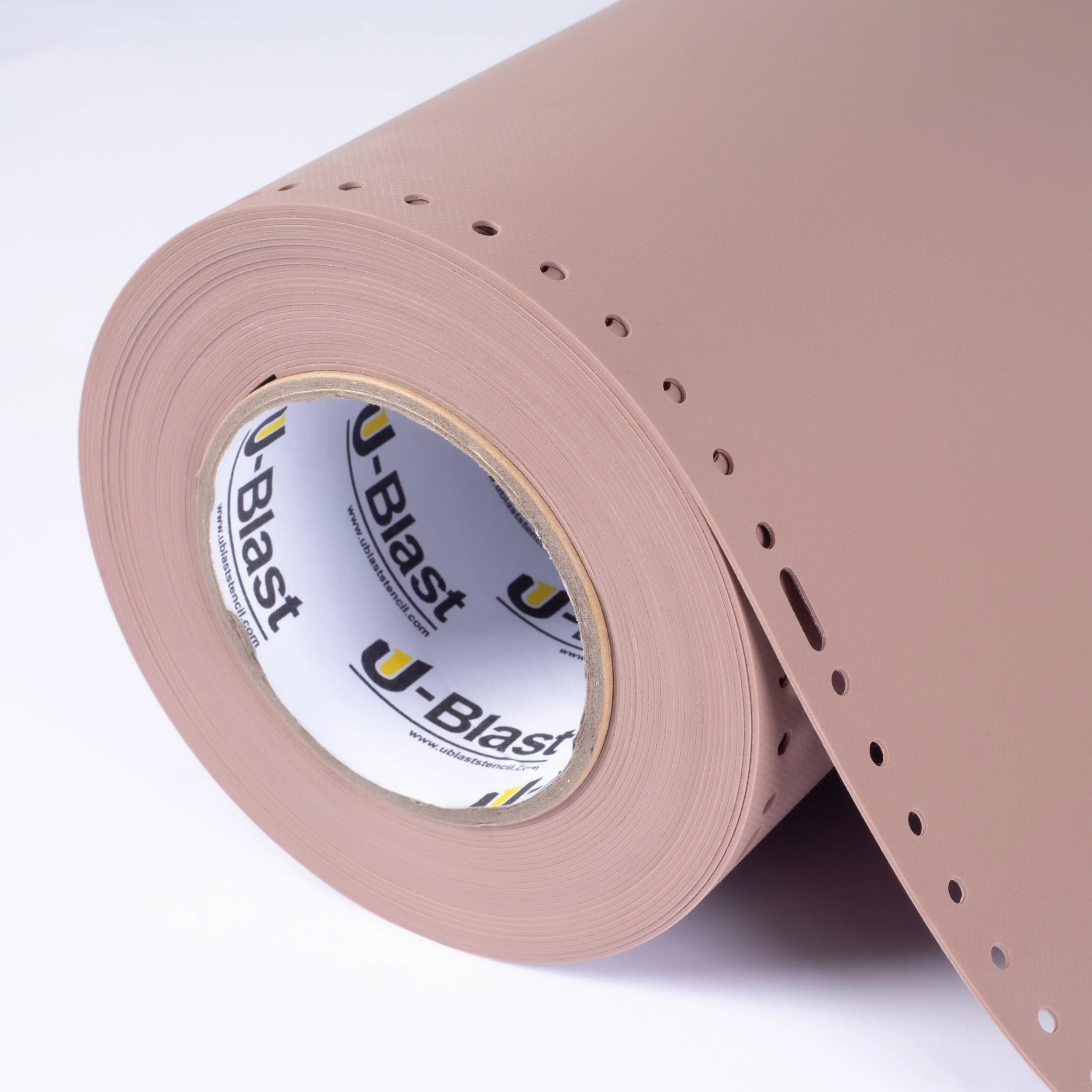 A roll of pink rubber stencil with small holes and a U-Blast brand inner core.