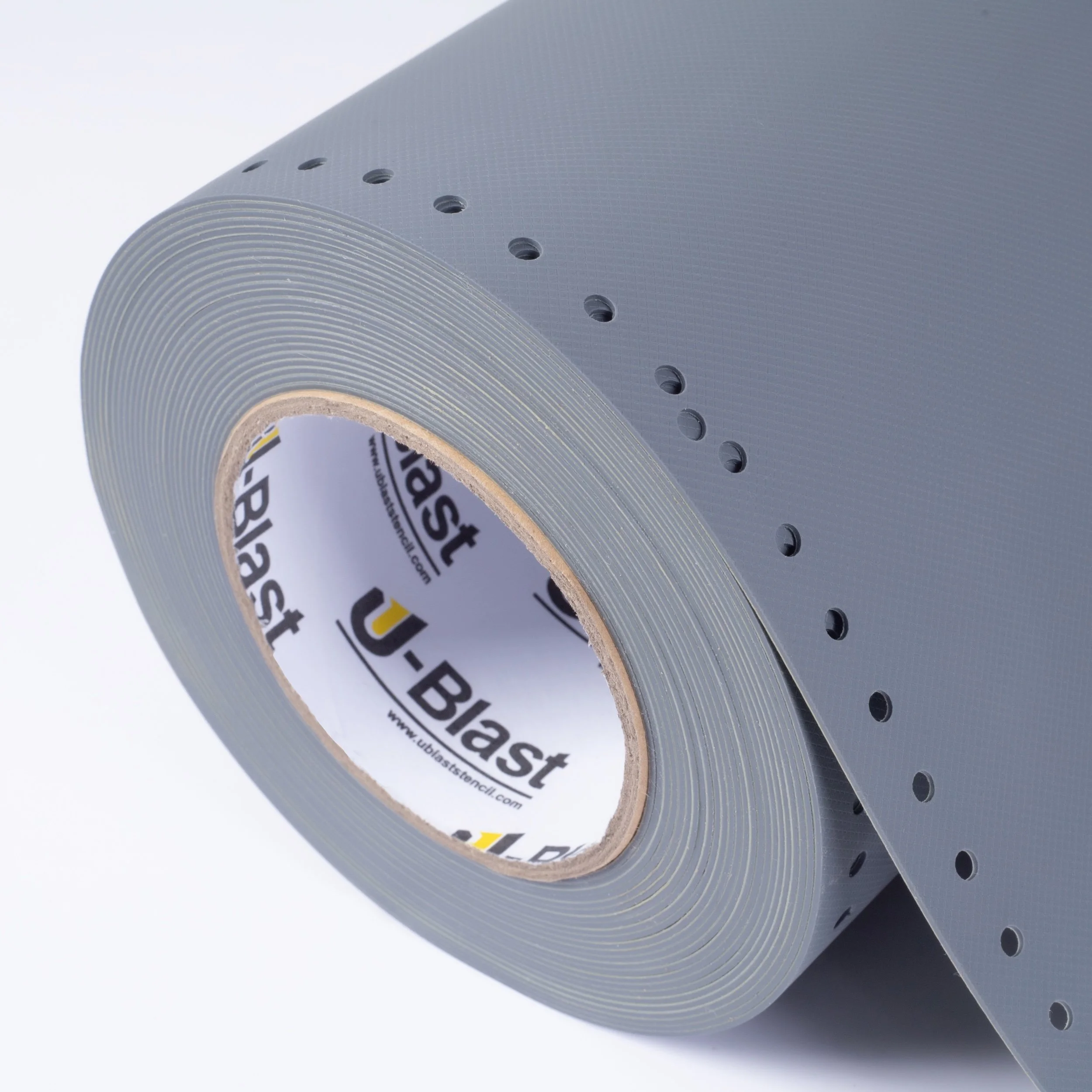 Roll of perforated black mounting tape with a U-Blast label inside the center hole.