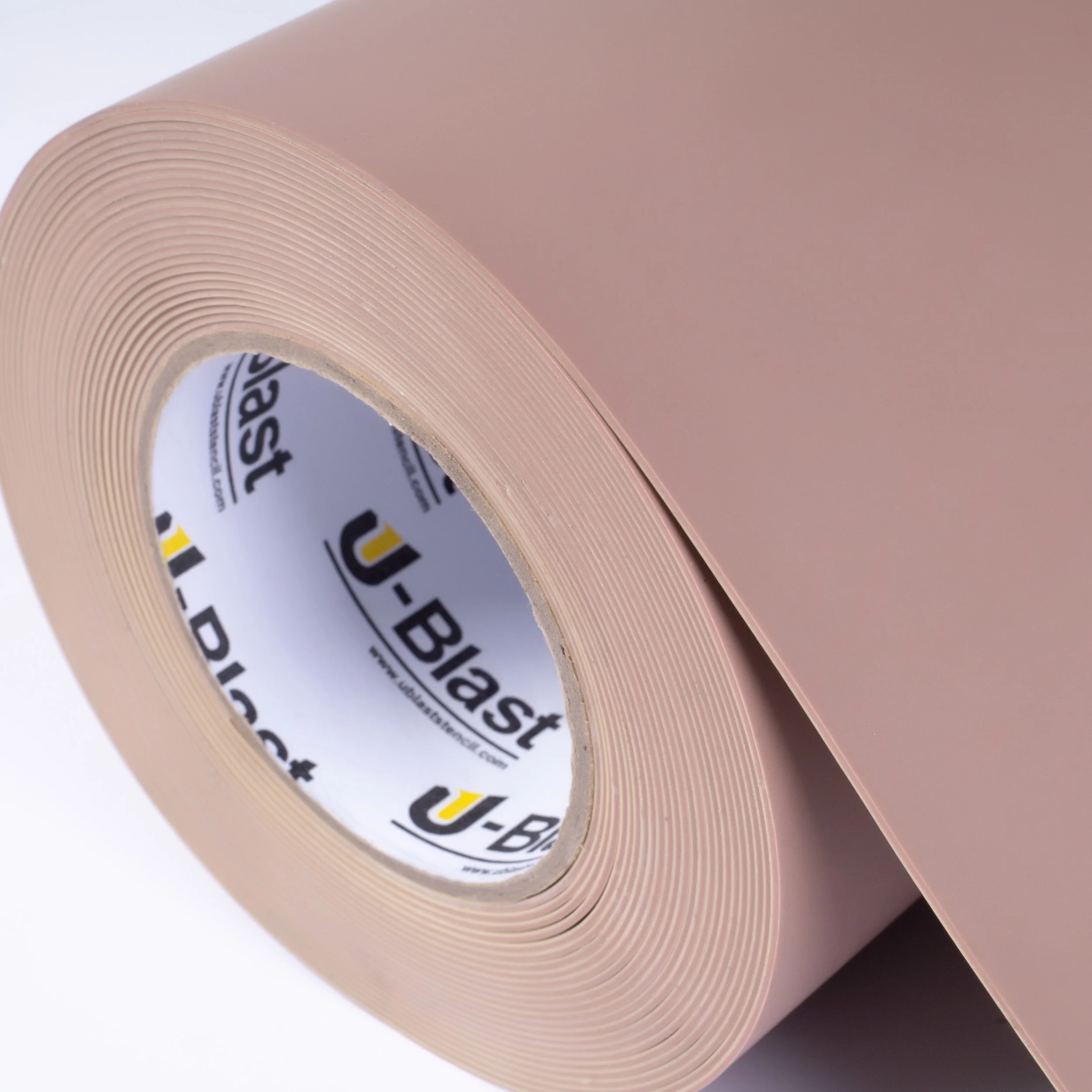 A roll of pink rubber stencil with small holes and a U-Blast brand inner core.