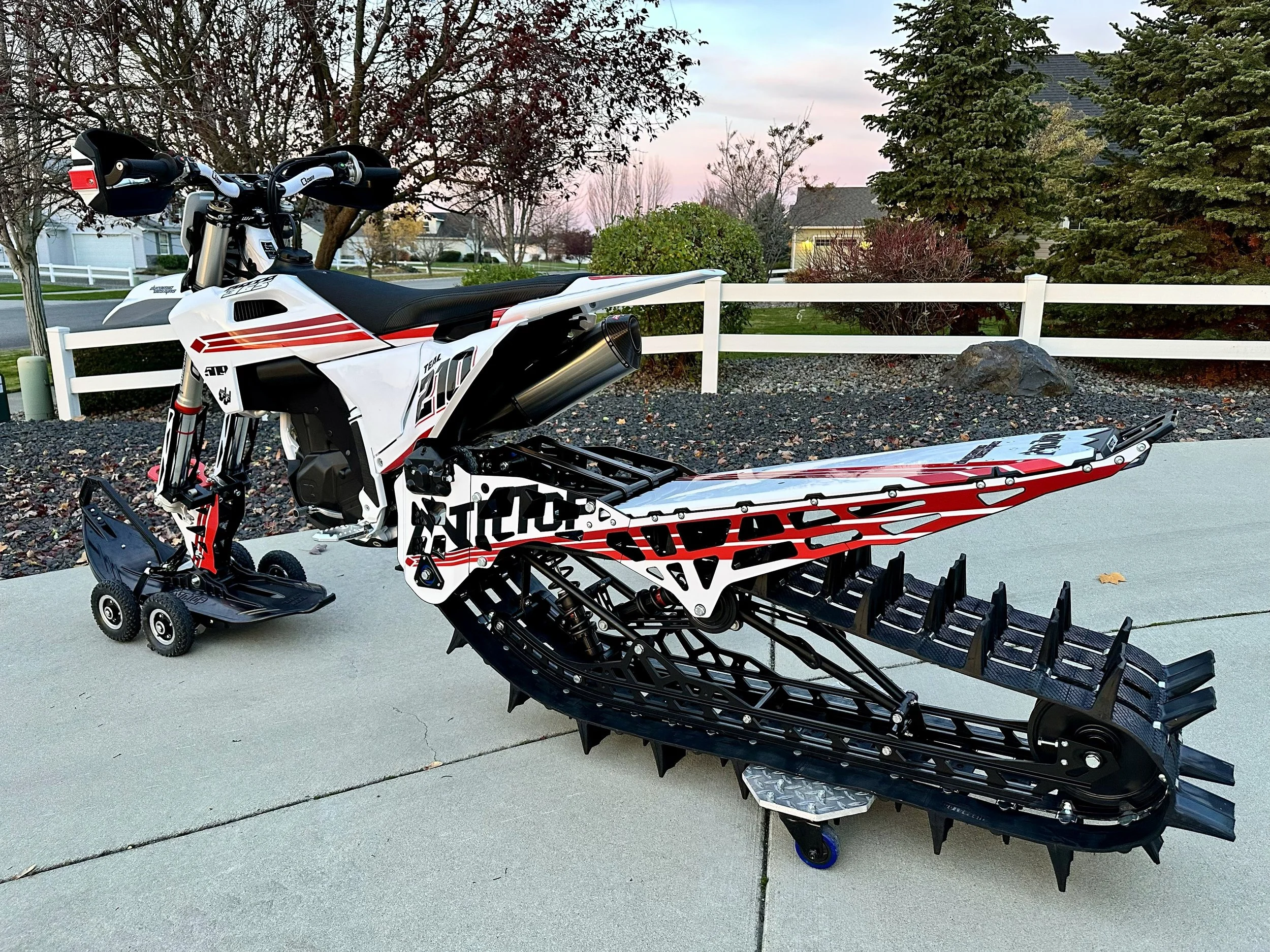 Custom KTM snowbike build parked on a driveway