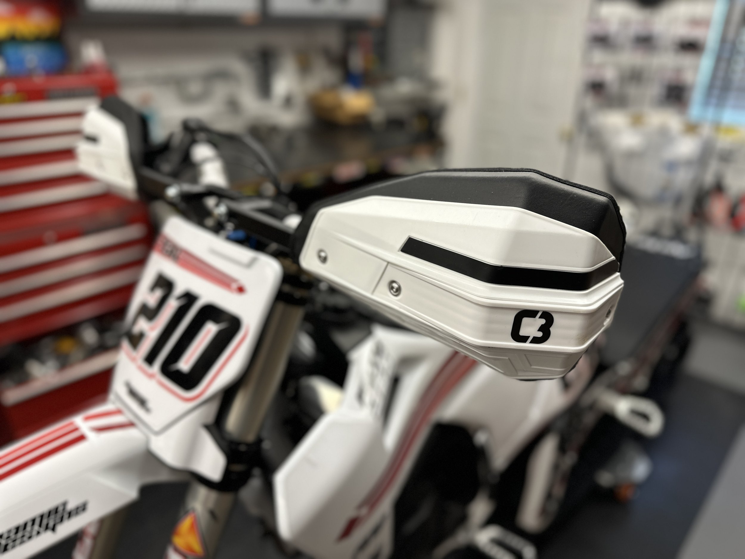 White C3 FORCEFIELD handguard on the Moto365 snowbike