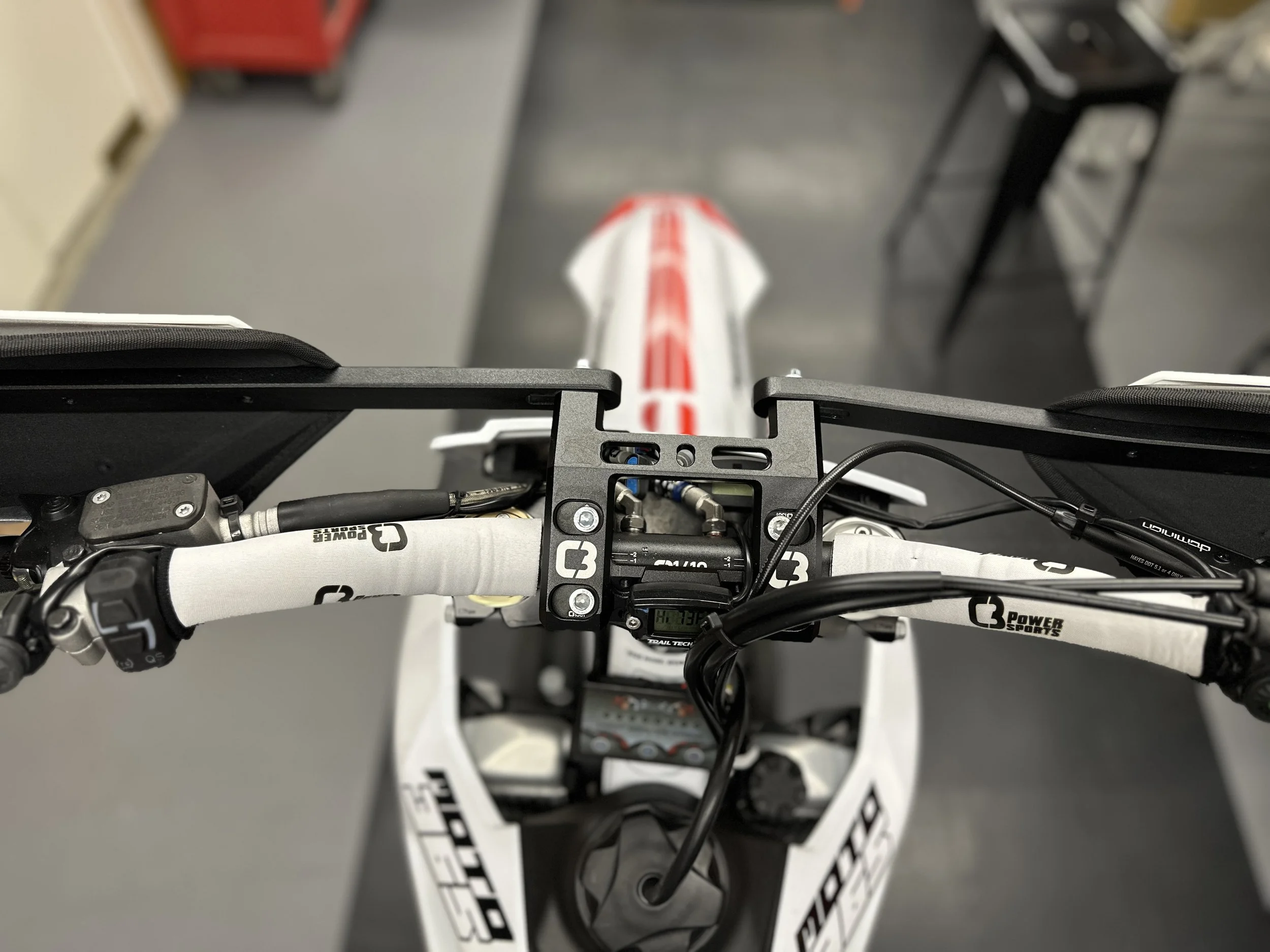 Rider view of heated handlebars, bar sleeves and Trail Tech gauges