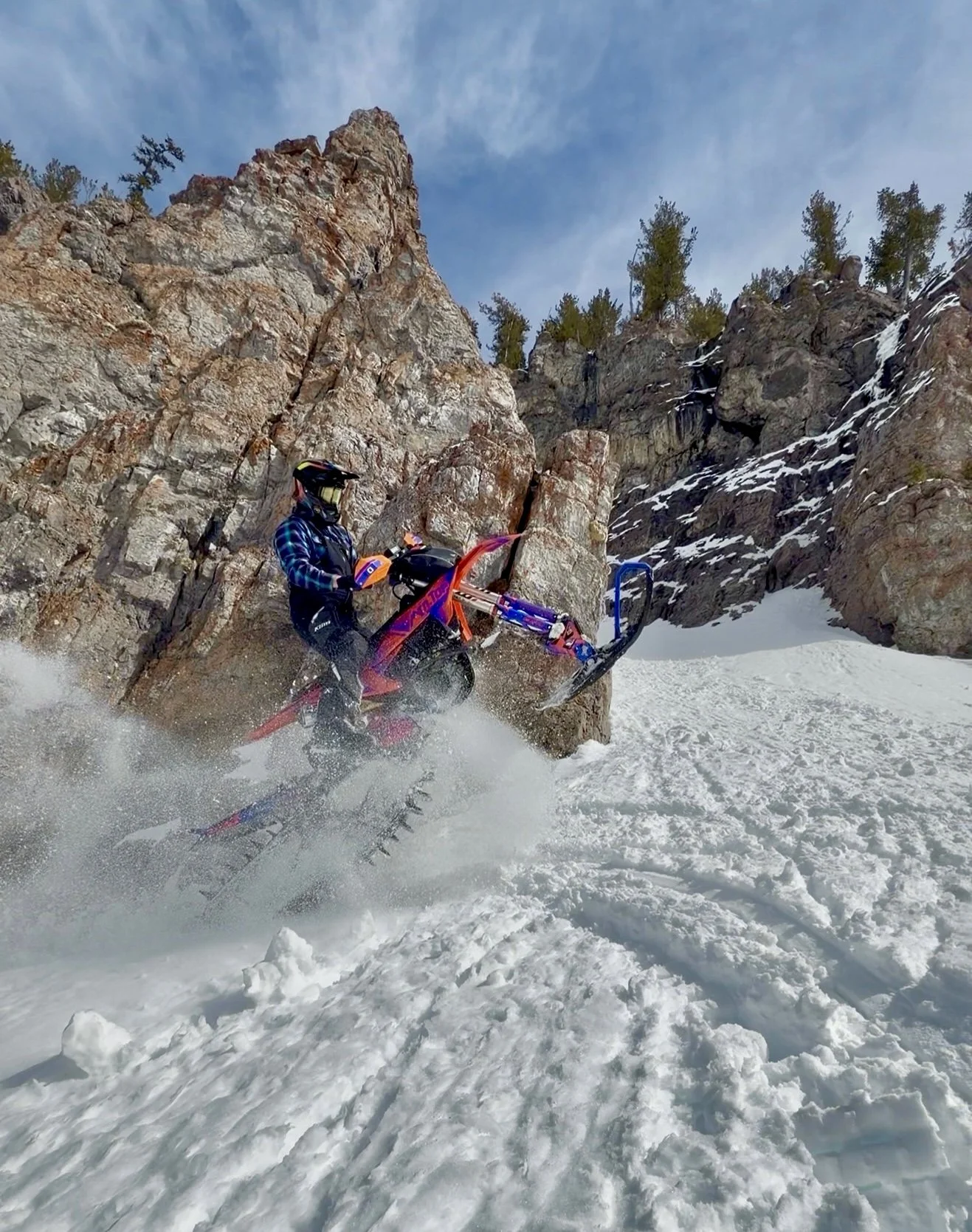 Allen Mangum riding a 2026 KTM 450 SX-F with an MTN.TOP TRKSTR snowbike kit near Island Park, Idaho