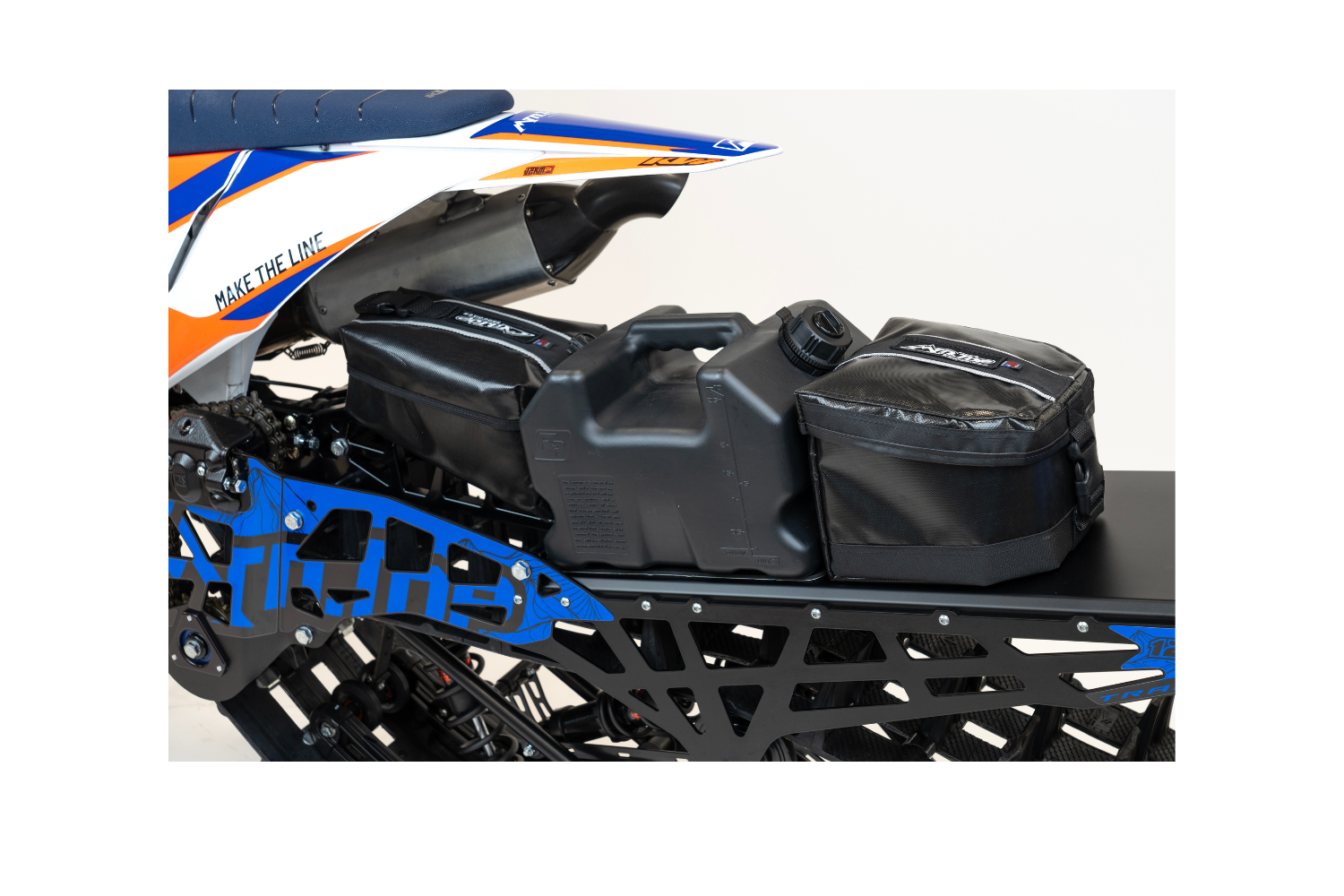 Installed MTN.TOP Rear Tunnel Bag and fuel can behind the snowbike seat
