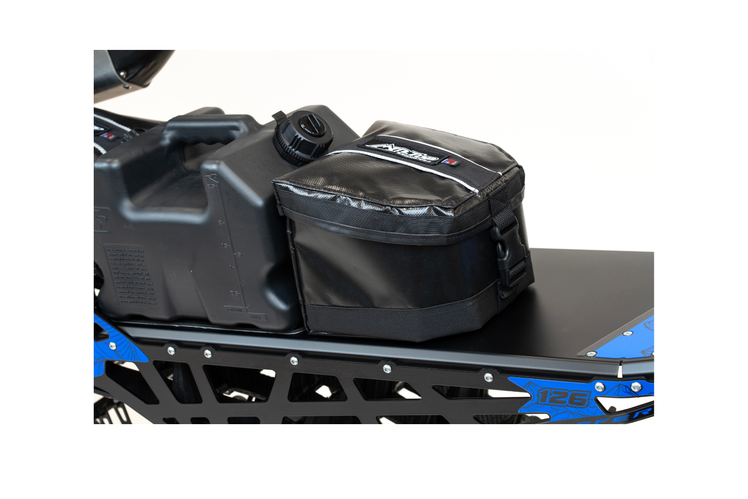 MTN.TOP Rear Tunnel Bag mounted beside a fuel can on a snowbike tunnel